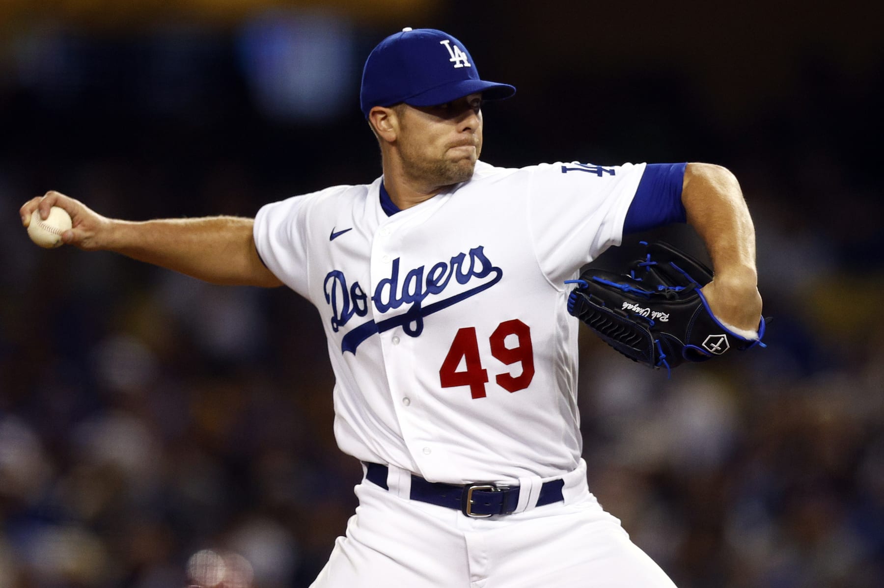 LOS ANGELES, CALIFORNIA - APRIL 14:  Blake Treinen #49 of the Los Angeles Dodgers throws against the Cincinnati Reds in the eighth inning during the opening series at Dodger Stadium on April 14, 2022 in Los Angeles, California. (Photo by Ronald Martinez/Getty Images)