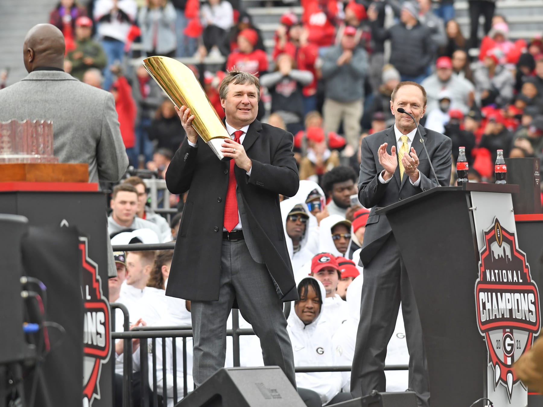 ATHENS, GA - JANUARY 15: Georgia Bulldogs Head Coach Kirby Smart holds the College Football Playoff National Championship trophy during the Georgia Bulldogs National Championship Celebration on January 15, 2022 at Sanford Stadium in Athens, GA.(Photo by Jeffrey Vest/Icon Sportswire via Getty Images)