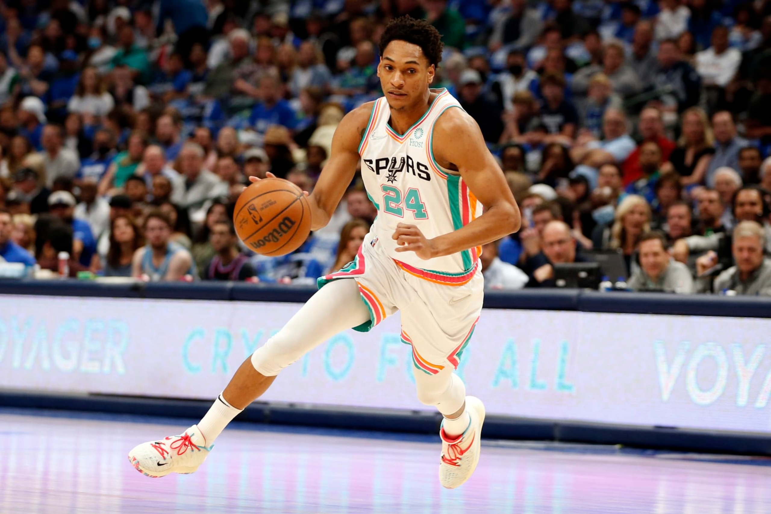 DALLAS, TEXAS - APRIL 10: Devin Vassell #24 of the San Antonio Spurs dribbles the ball in the game against the Dallas Mavericks at American Airlines Center on April 10, 2022 in Dallas, Texas. NOTE TO USER: User expressly acknowledges and agrees that, by downloading and or using this photograph, User is consenting to the terms and conditions of the Getty Images License Agreement. (Photo by Tim Heitman/Getty Images) DALLAS, TEXAS - APRIL 10: Devin Vassell #24 of the San Antonio Spurs dribbles the ball in the game against the Dallas Mavericks at American Airlines Center on April 10, 2022 in Dallas, Texas. NOTE TO USER: User expressly acknowledges and agrees that, by downloading and or using this photograph, User is consenting to the terms and conditions of the Getty Images License Agreement. (Photo by Tim Heitman/Getty Images)