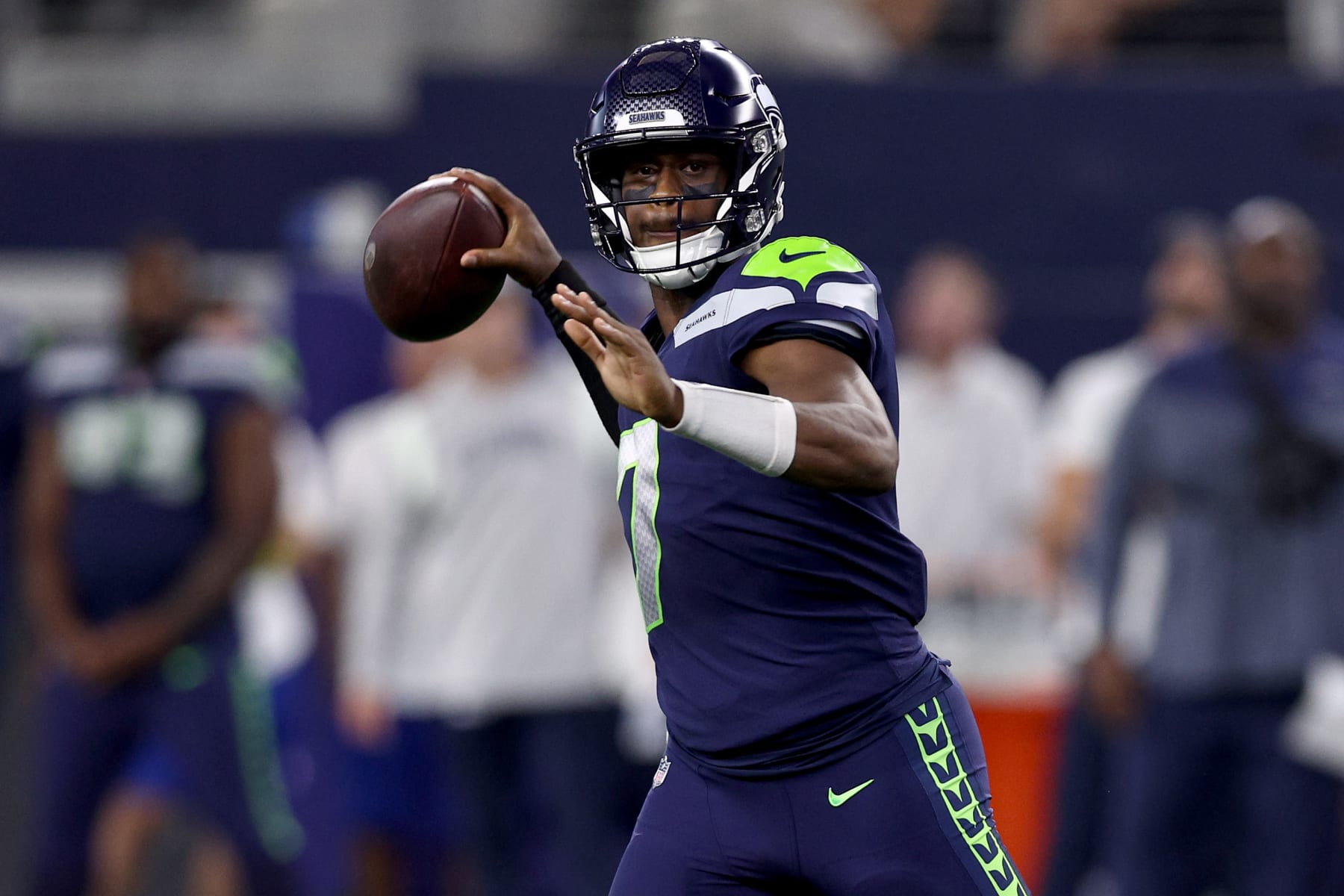 ARLINGTON, TEXAS - AUGUST 26: Quarterback Geno Smith #7 of the Seattle Seahawks looks for an open receiver against the Dallas Cowboys in the first quarter a NFL preseason football game at AT&T Stadium on August 26, 2022 in Arlington, Texas. (Photo by Tom Pennington/Getty Images)