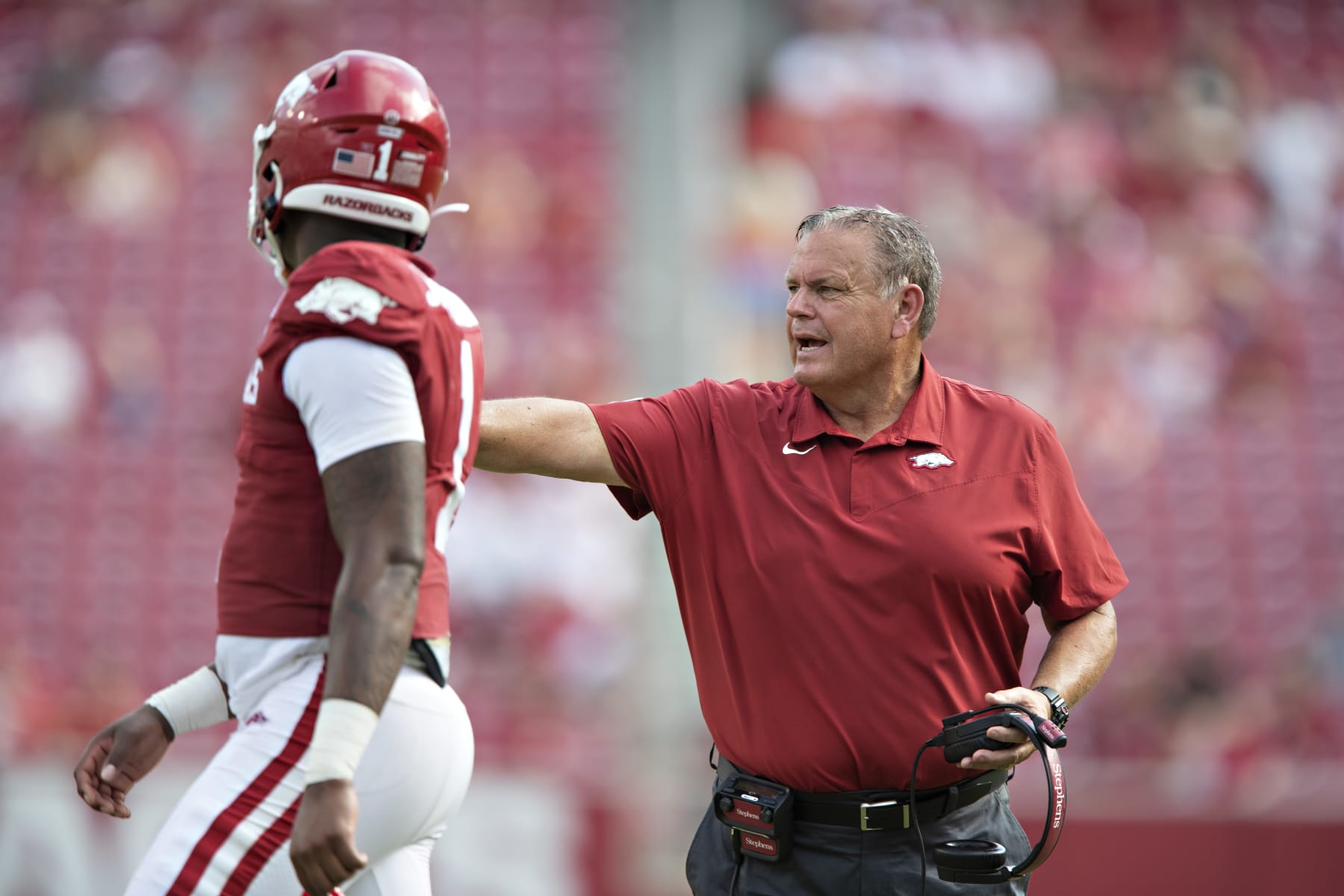 FAYETTEVILLE, AR - SEPTEMBER 4:  Head Coach Sam Pittman of the Arkansas Razorbacks talks during a timeout with KJ Jefferson #1 in the second half of a game against the Rice Owls at Donald W. Reynolds Razorback Stadium on September 4, 2021 in Fayetteville, Arkansas.  The Razorbacks defeated the Owls 38-17.  (Photo by Wesley Hitt/Getty Images)