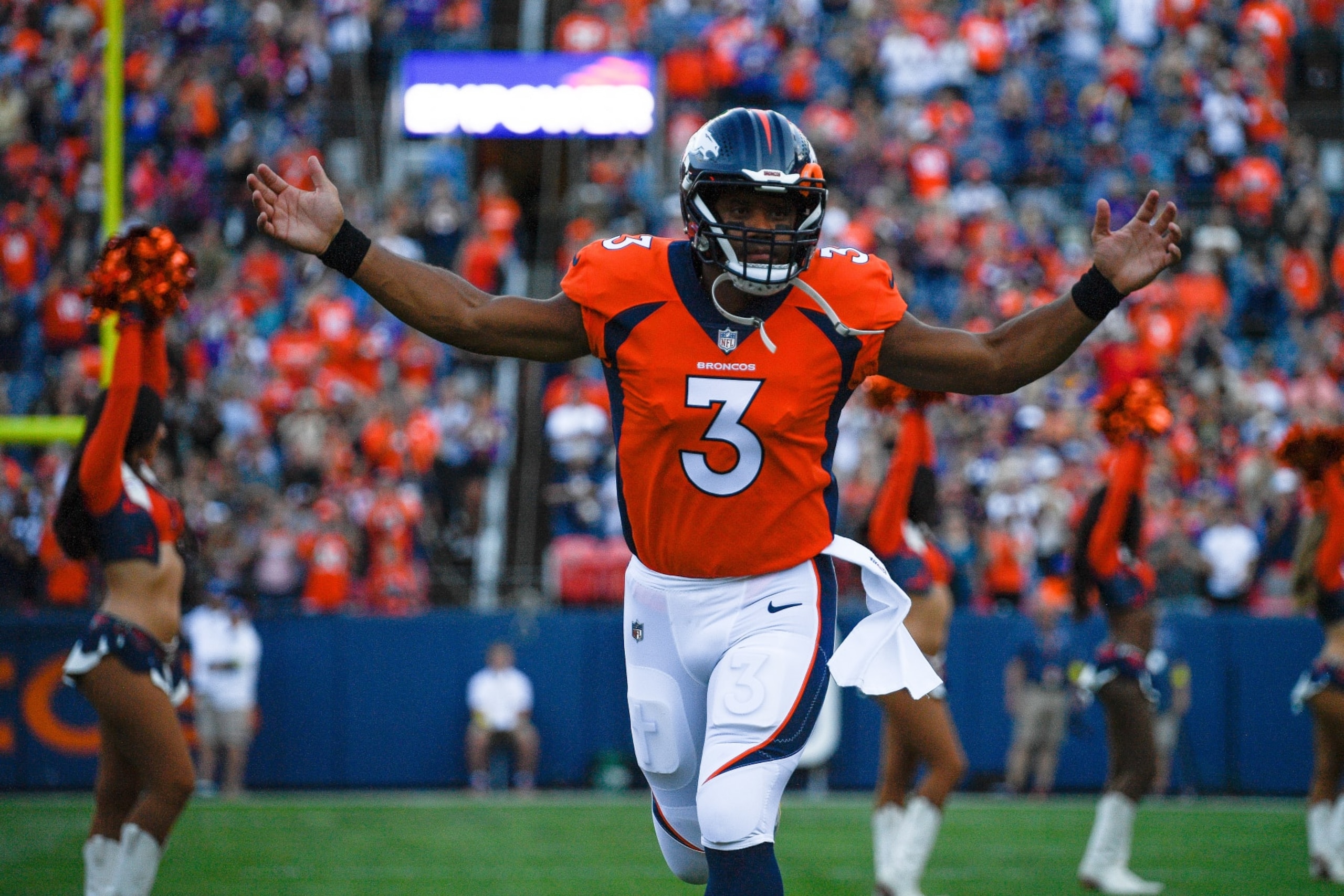 DENVER, COLORADO - AUGUST 27:  Quarterback Russell Wilson #3 of the Denver Broncos runs onto the field before a preseason game against the Minnesota Vikings at Empower Field at Mile High on August 27, 2022 in Denver, Colorado. (Photo by Dustin Bradford/Getty Images)