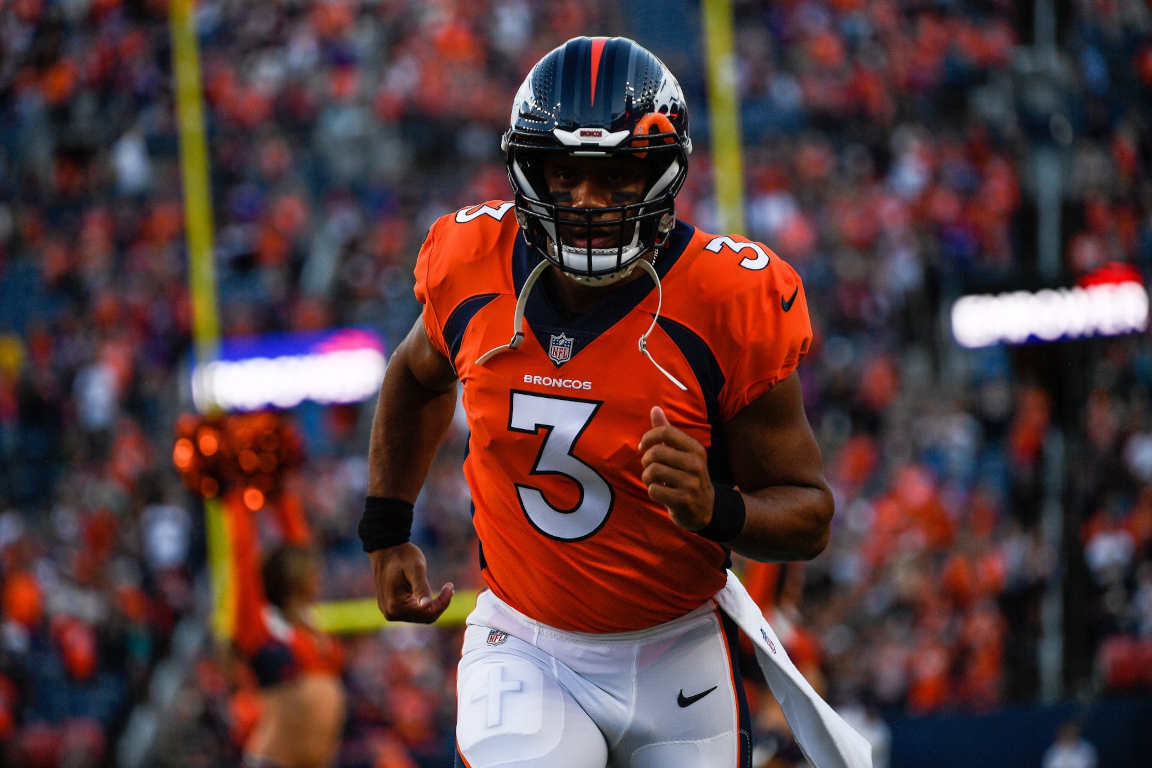 DENVER, COLORADO - AUGUST 27: Quarterback Russell Wilson #3 of the Denver Broncos runs onto the field before a preseason NFL game against the Minnesota Vikings at Empower Field at Mile High on August 27, 2022 in Denver, Colorado. (Photo by Dustin Bradford/Getty Images) DENVER, COLORADO - AUGUST 27: Quarterback Russell Wilson #3 of the Denver Broncos runs onto the field before a preseason NFL game against the Minnesota Vikings at Empower Field at Mile High on August 27, 2022 in Denver, Colorado. (Photo by Dustin Bradford/Getty Images)
