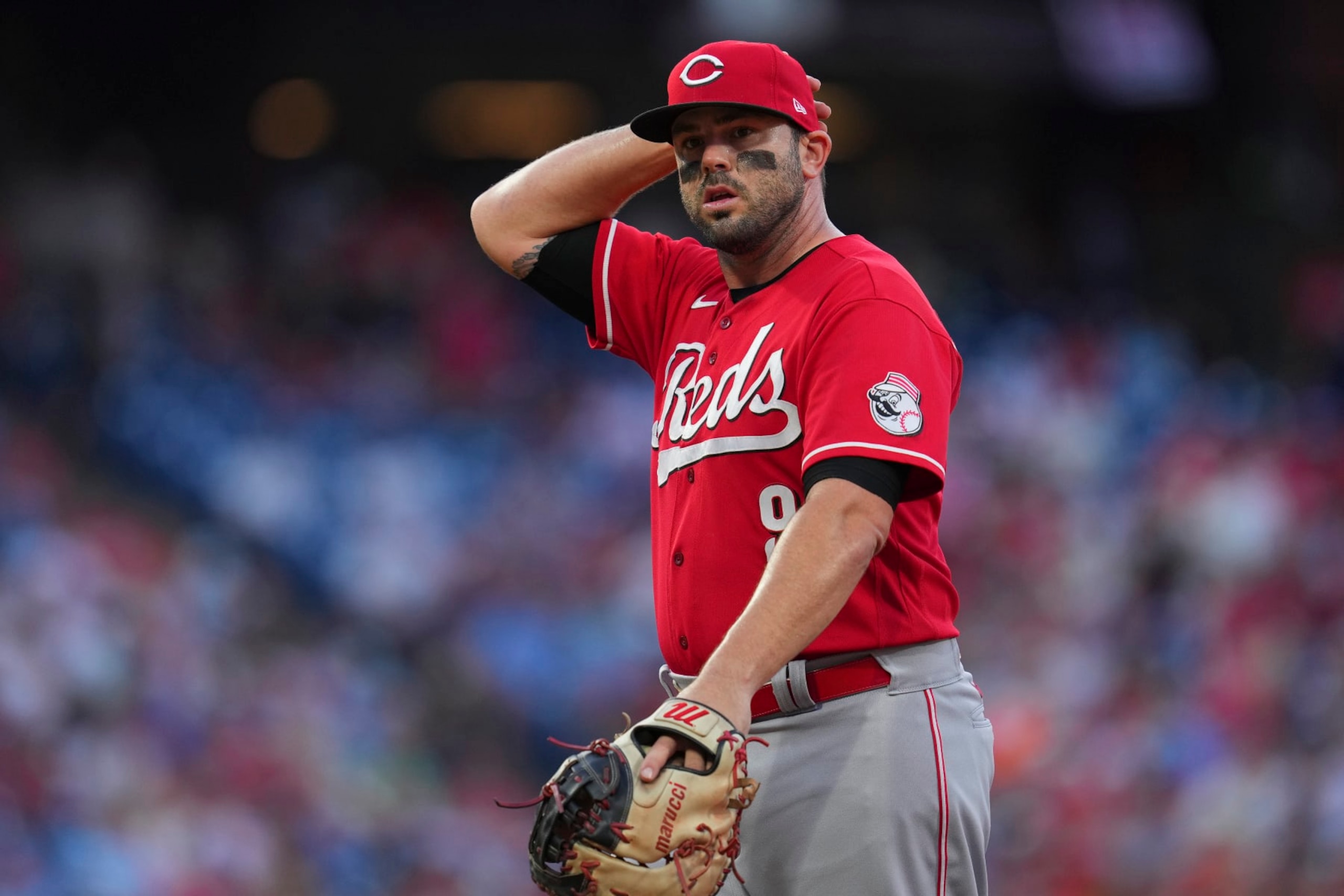 PHILADELPHIA, PA - AUGUST 23: Mike Moustakas #9 of the Cincinnati Reds looks on against the Philadelphia Phillies at Citizens Bank Park on August 23, 2022 in Philadelphia, Pennsylvania. The Philadelphia Phillies defeated the Cincinnati Reds 7-6. (Photo by Mitchell Leff/Getty Images)