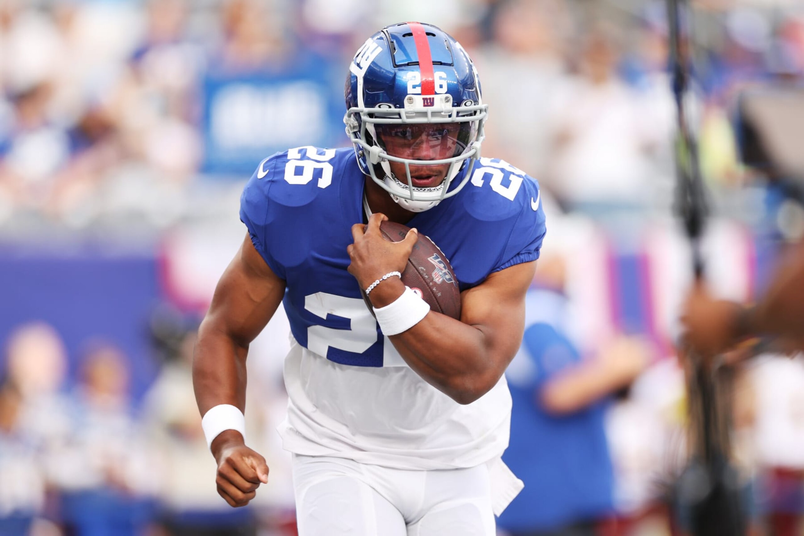 EAST RUTHERFORD, NEW JERSEY - AUGUST 21: Saquon Barkley #26 of the New York Giants carries the ball during warmups of a preseason game against the Cincinnati Bengals at MetLife Stadium on August 21, 2022 in East Rutherford, New Jersey. (Photo by Sarah Stier/Getty Images)