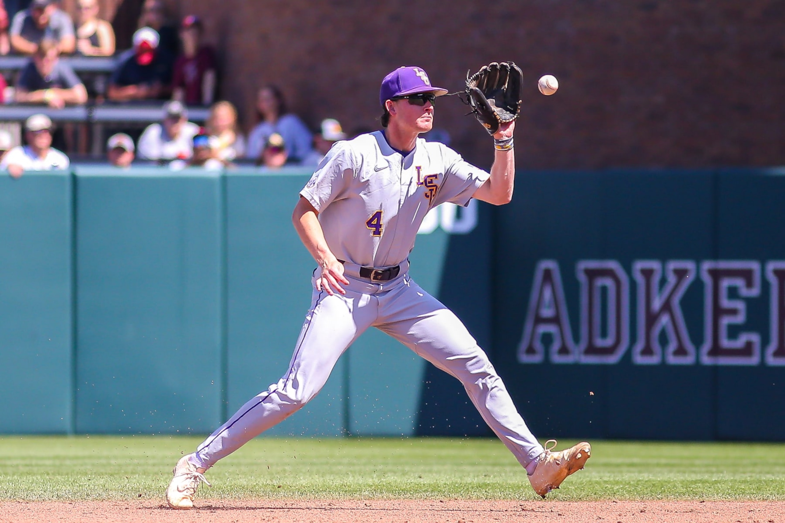 STARKVILLE, MS - APRIL 10: LSU Tigers infielder Cade Doughty (4) grabs a line drive during the game between the Mississippi State Bulldogs and the LSU Tigers on April 10, 2022 at Dudy Noble Field, Polk-DeMent Stadium in Starkville, Ms. (Photo by Chris McDill/Icon Sportswire via Getty Images)