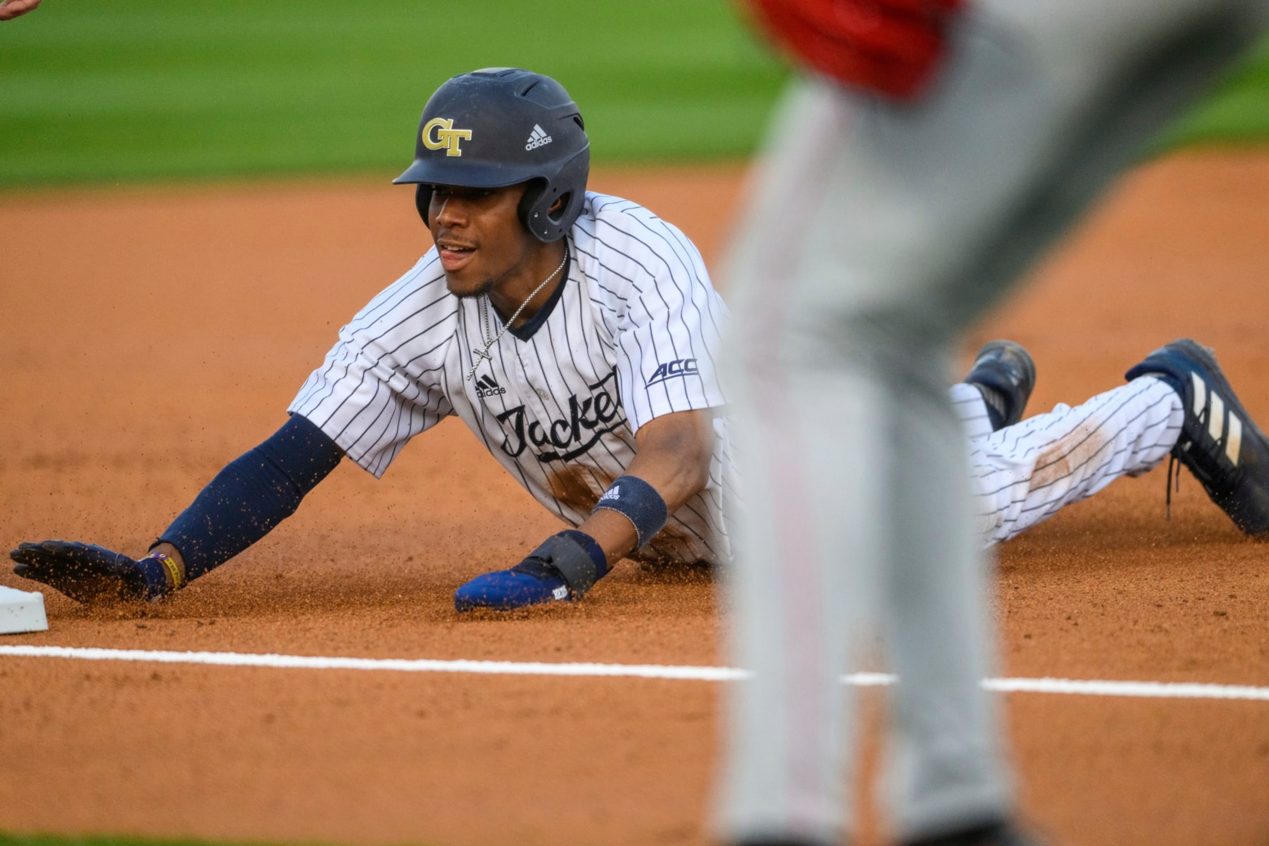 Georgia Tech infielder Chandler Simpson (1) slides into third base during an NCAA baseball game against Georgia on Friday, March 4, 2022 in Atlanta. Georgia Tech won 11-7. (AP Photo/Danny Karnik)