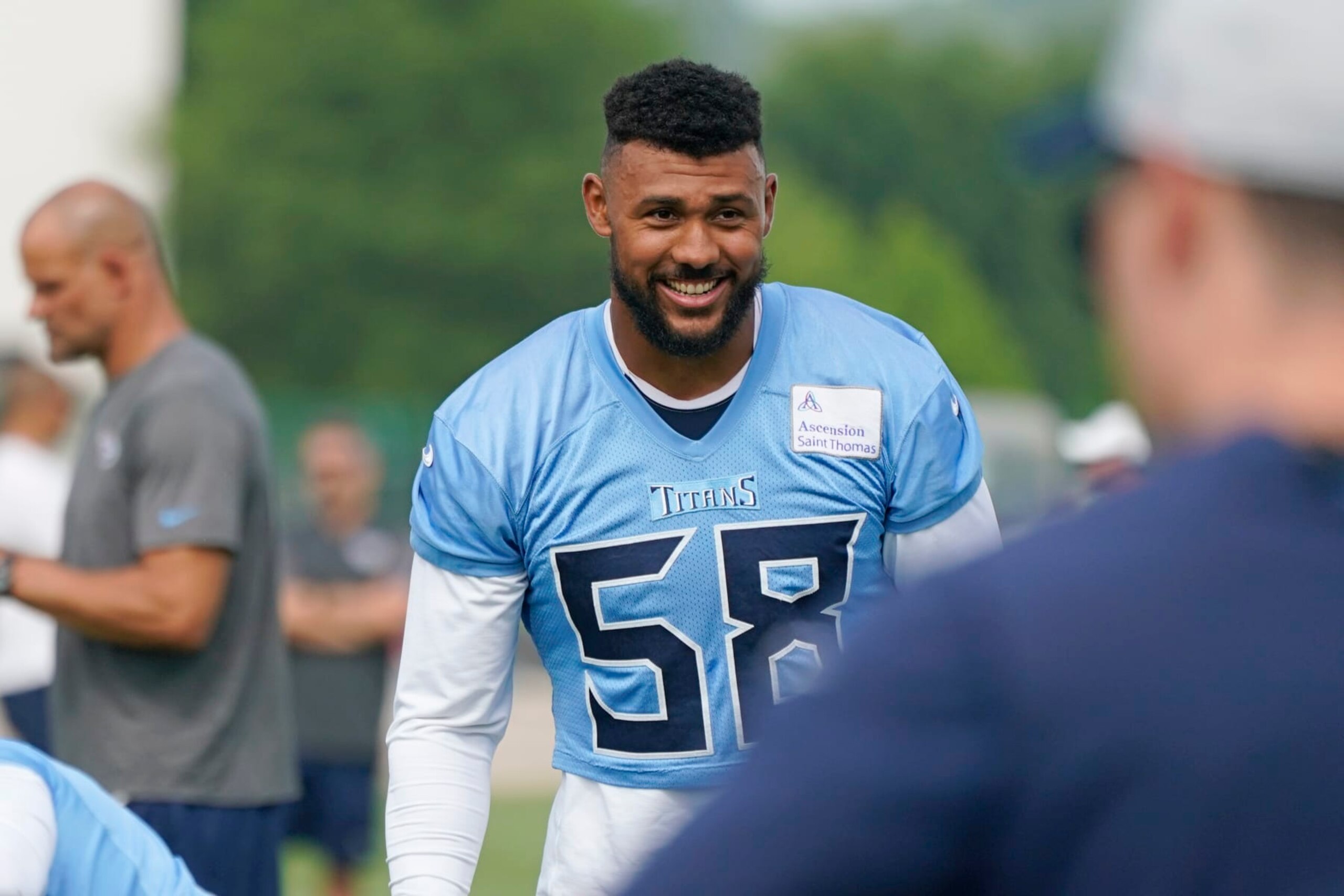 Tennessee Titans linebacker Harold Landry III (58) warms up at the NFL football team's practice facility Tuesday, June 14, 2022, in Nashville, Tenn. (AP Photo/Mark Humphrey)