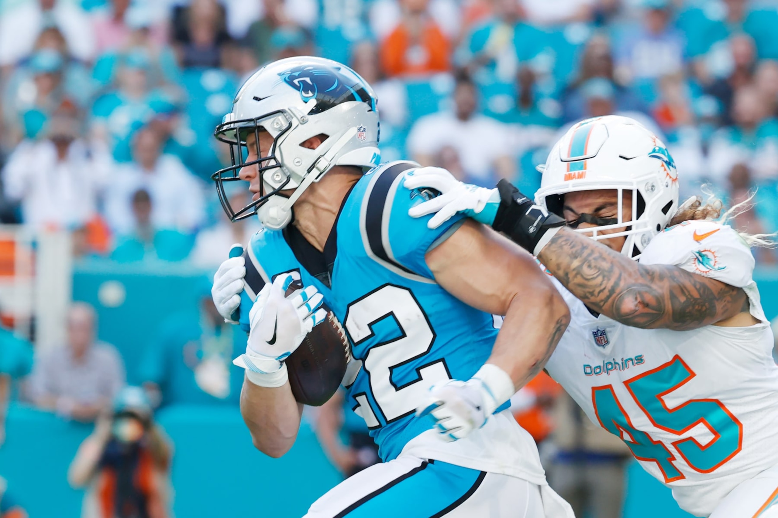 MIAMI GARDENS, FLORIDA - NOVEMBER 28: Christian McCaffrey #22 of the Carolina Panthers during their game against the Miami Dolphins at Hard Rock Stadium on November 28, 2021 in Miami Gardens, Florida. (Photo by Cliff Hawkins/Getty Images) MIAMI GARDENS, FLORIDA - NOVEMBER 28: Christian McCaffrey #22 of the Carolina Panthers during their game against the Miami Dolphins at Hard Rock Stadium on November 28, 2021 in Miami Gardens, Florida. (Photo by Cliff Hawkins/Getty Images)