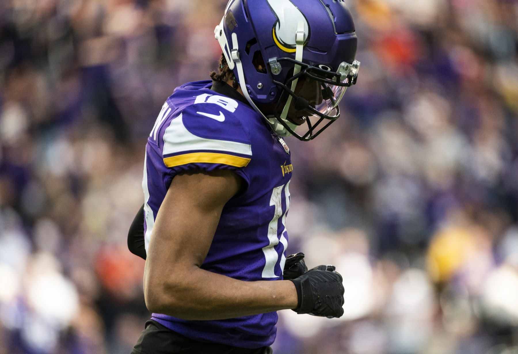 MINNEAPOLIS, MN - JANUARY 09: Justin Jefferson #18 of the Minnesota Vikings runs to the sidelines after scoring a touchdown in the fourth quarter of the game against the Chicago Bears at U.S. Bank Stadium on January 9, 2022 in Minneapolis, Minnesota. (Photo by Stephen Maturen/Getty Images)