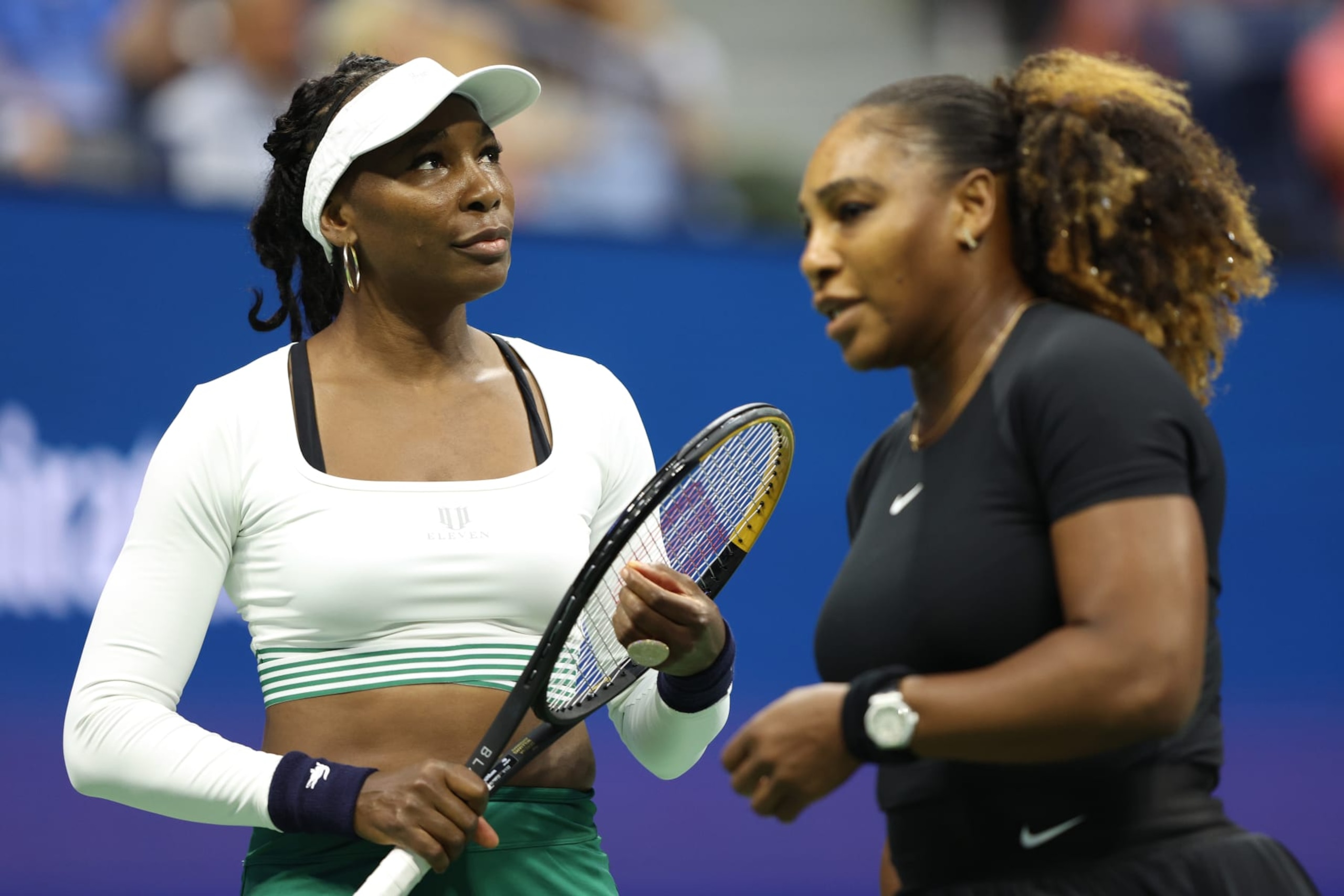 NEW YORK, NEW YORK - SEPTEMBER 01: Venus Williams looks on with partner Serena Williams of the United States against Lucie Hradecka and Linda Noskova of Czech Republic during the Women’s Doubles First Round match on Day Four of the 2022 US Open at USTA Billie Jean King National Tennis Center on September 01, 2022 in the Flushing neighborhood of the Queens borough of New York City. (Photo by Jamie Squire/Getty Images)