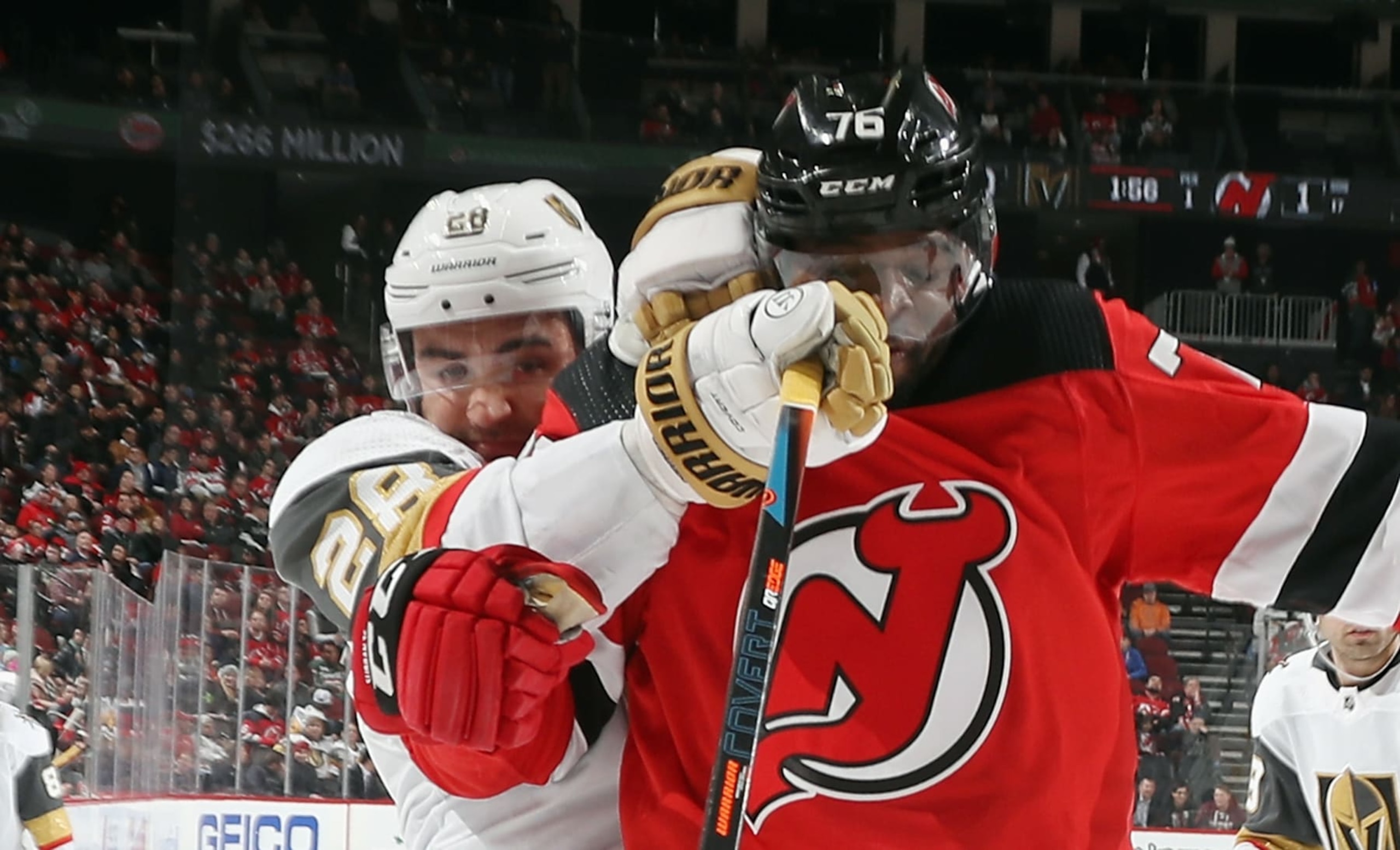 NEWARK, NEW JERSEY - DECEMBER 03: William Carrier #28 of the Vegas Golden Knights gets the gloves up on P.K. Subban #76 of the New Jersey Devils during the first period at the Prudential Center on December 03, 2019 in Newark, New Jersey. (Photo by Bruce Bennett/Getty Images)