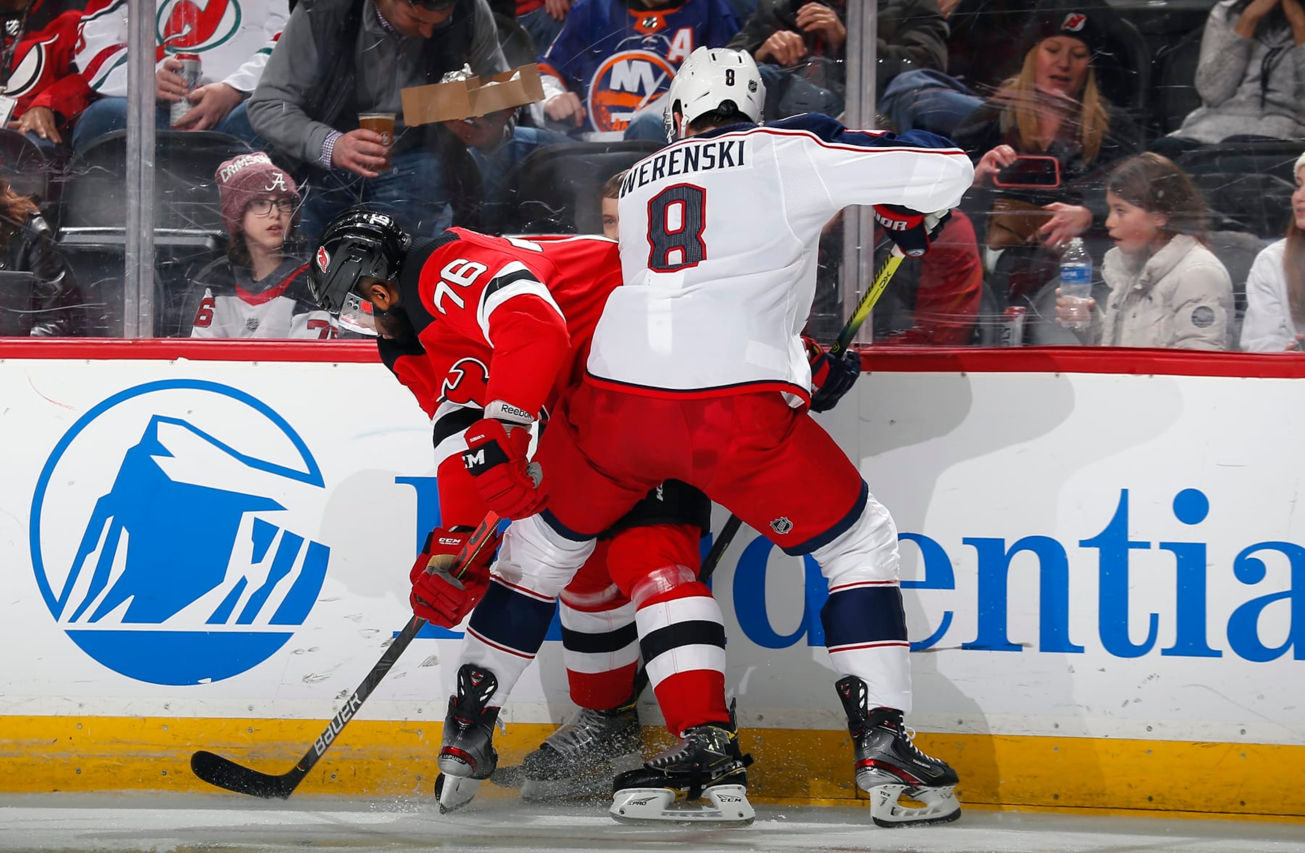 NEWARK, NJ - FEBRUARY 16: P.K. Subban #76 of the New Jersey Devils and Zach Werenski #8 of the Columbus Blue Jackets battle for position during the game at the Prudential Center on February 16, 2020 in Newark, New Jersey. (Photo by Andy Marlin/NHLI via Getty Images)