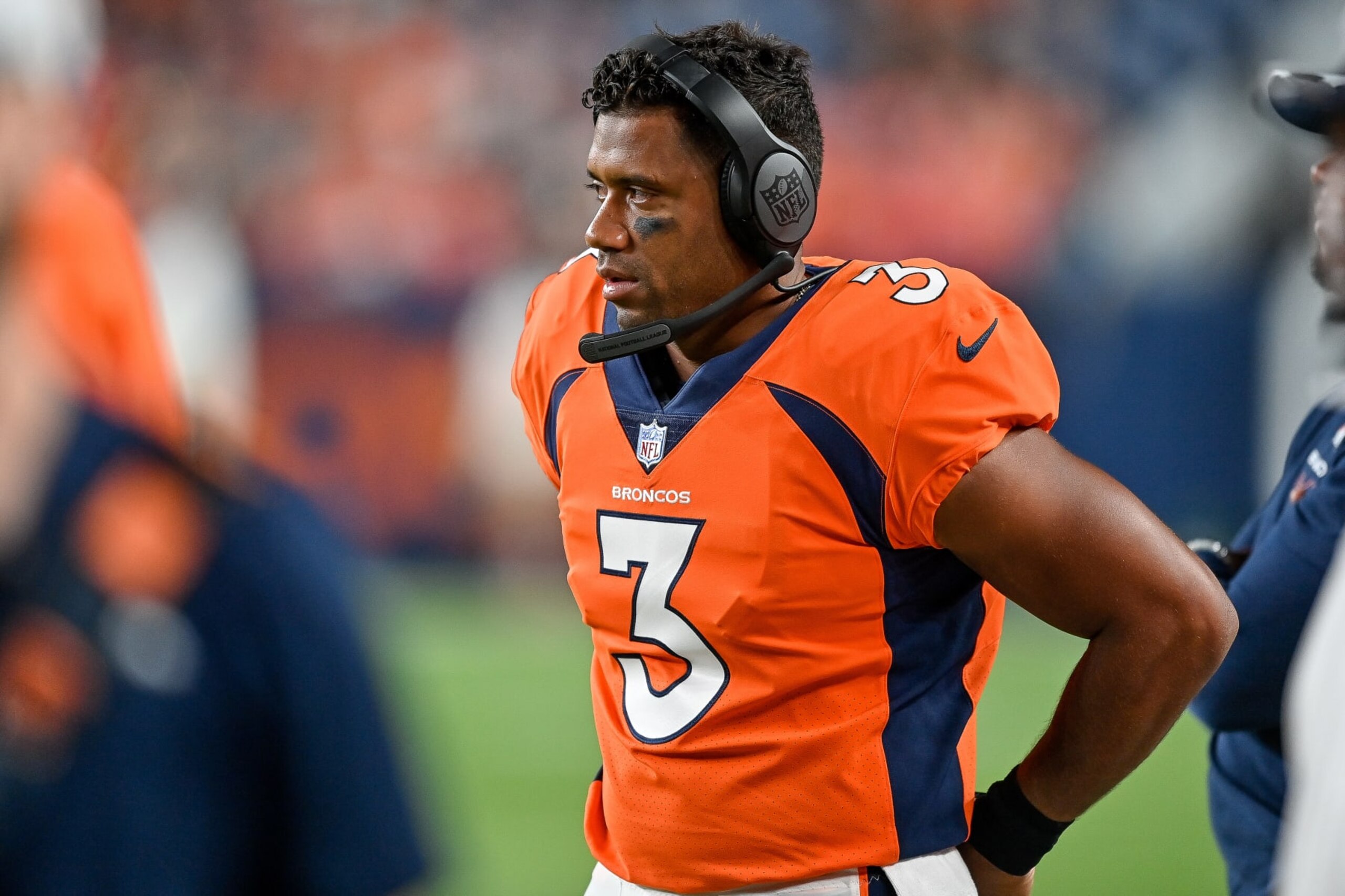 DENVER, COLORADO - AUGUST 27:  Quarterback Russell Wilson #3 of the Denver Broncos stands on the sideline in the fourth quarter of a preseason NFL game against the Minnesota Vikings at Empower Field at Mile High on August 27, 2022 in Denver, Colorado. (Photo by Dustin Bradford/Getty Images)