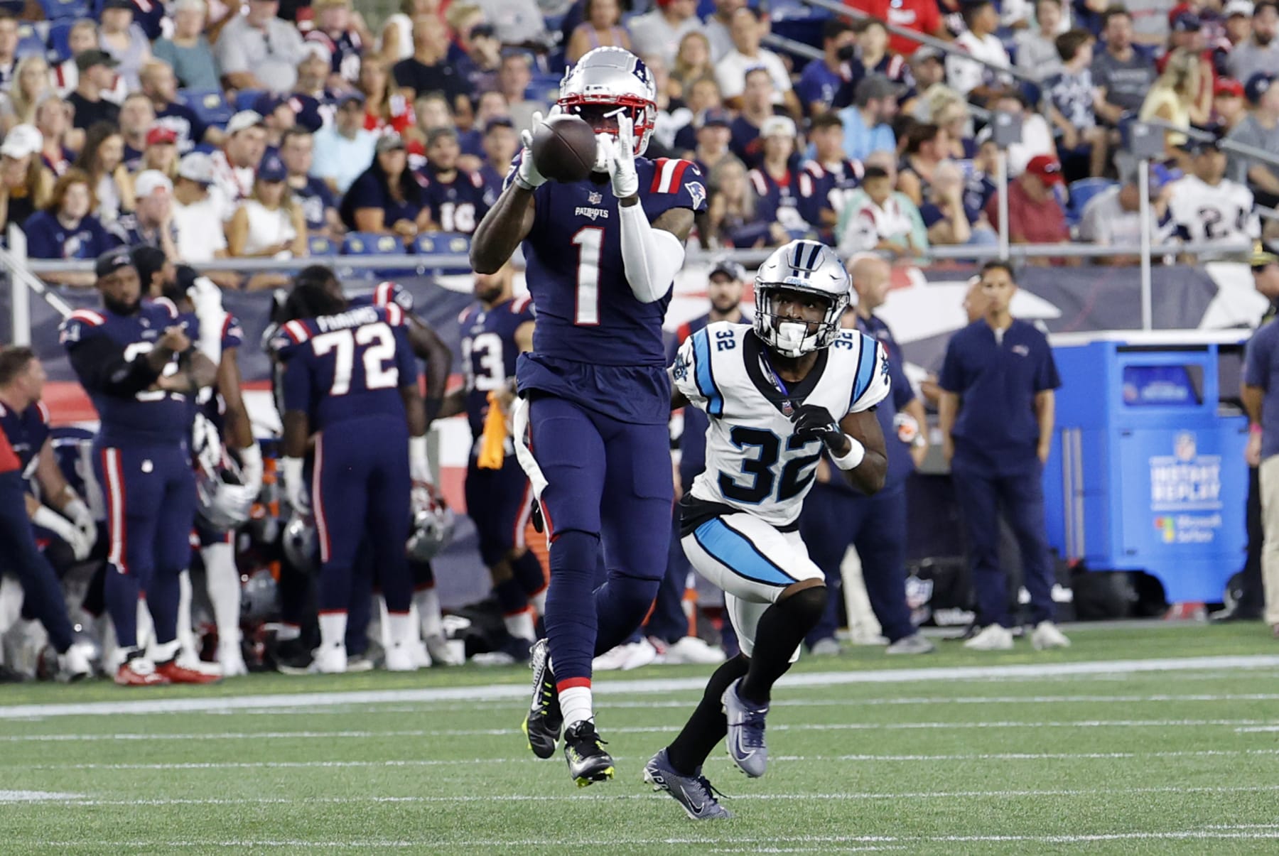 FOXBOROUGH, MA - AUGUST 19: New England Patriots wide receiver DeVante Parker (1) makes a catch in front of Carolina Panthers cornerback Tae Hayes (32) during an NFL preseason game between the New England Patriots and the Carolina Panthers on August 19, 2022, at Gillette Stadium in Foxborough, Massachusetts. (Photo by Fred Kfoury III/Icon Sportswire via Getty Images)
