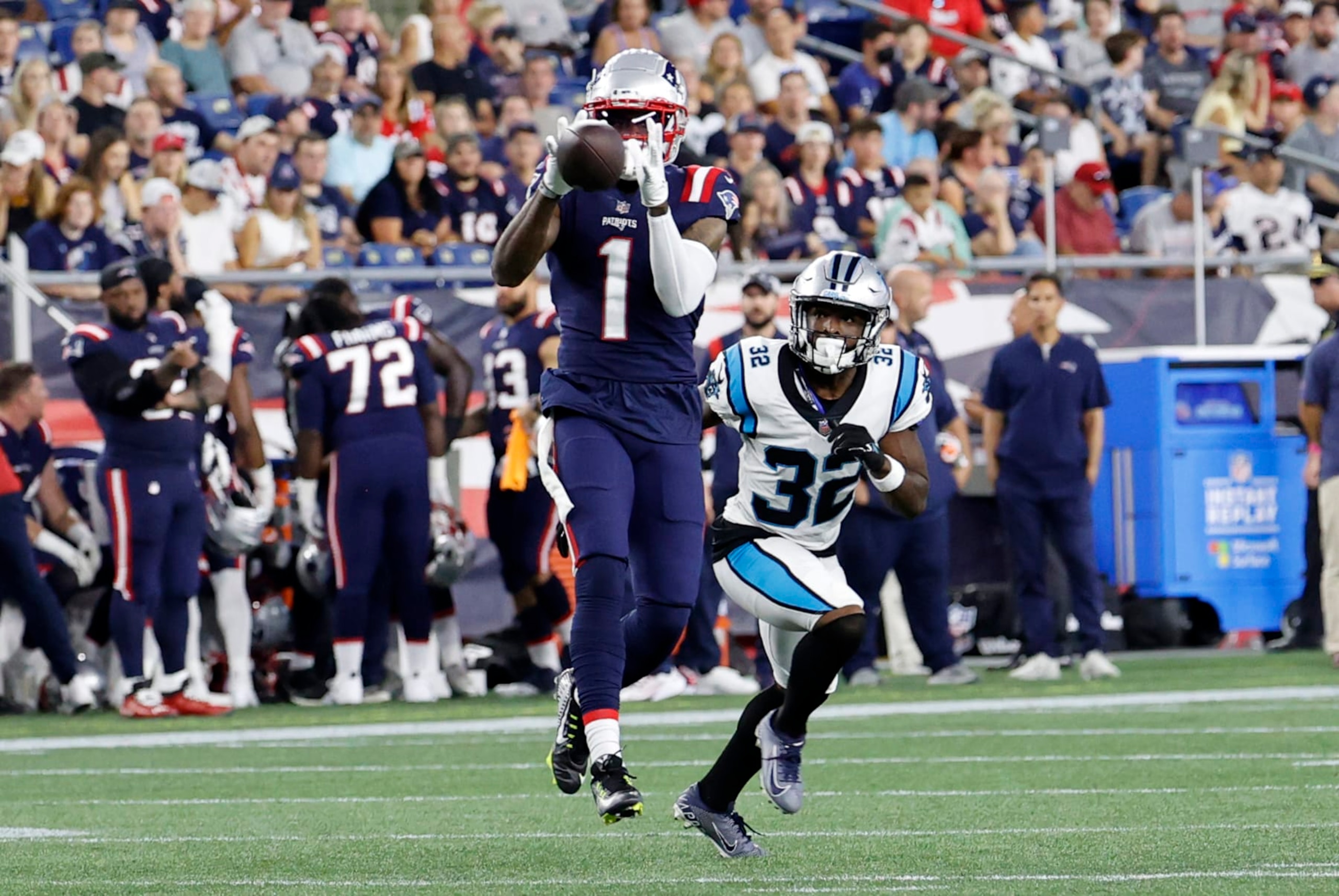 FOXBOROUGH, MA - AUGUST 19: New England Patriots wide receiver DeVante Parker (1) makes a catch in front of Carolina Panthers cornerback Tae Hayes (32) during an NFL preseason game between the New England Patriots and the Carolina Panthers on August 19, 2022, at Gillette Stadium in Foxborough, Massachusetts. (Photo by Fred Kfoury III/Icon Sportswire via Getty Images)