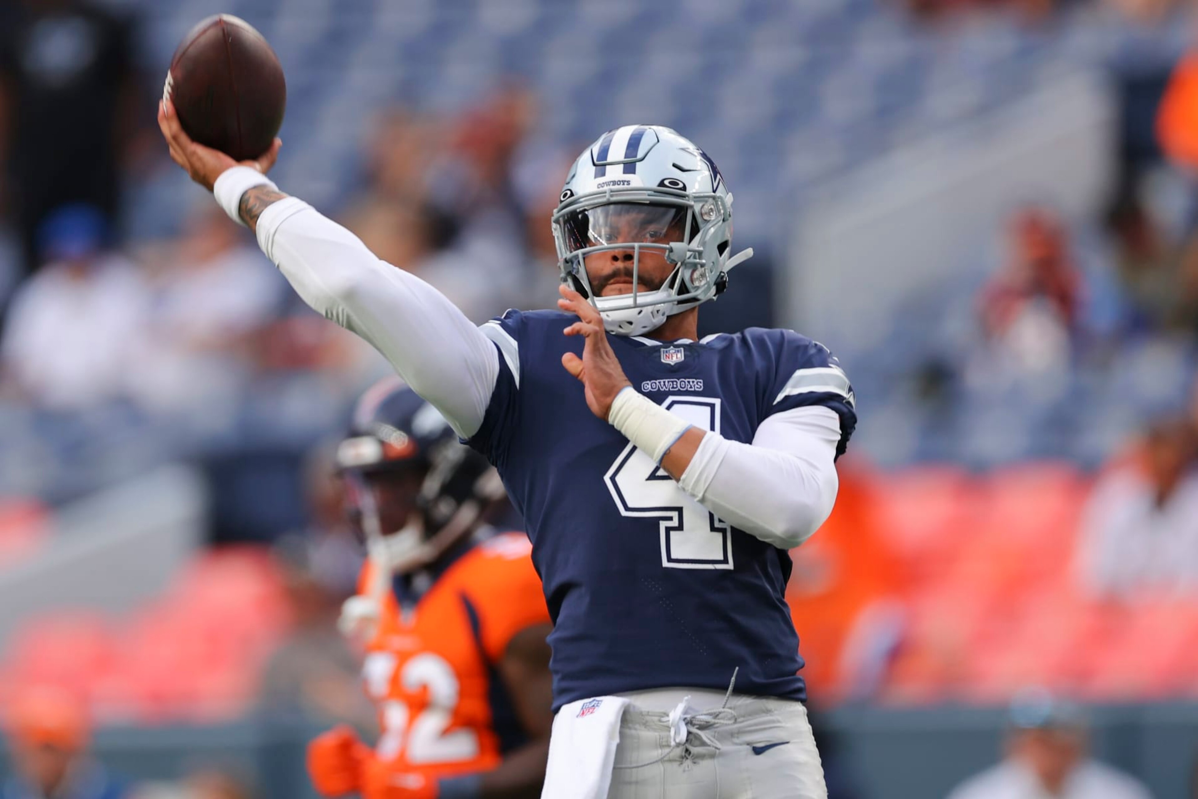 DENVER, CO - AUGUST 13: Dak Prescott #4 of the Dallas Cowboys warms up before the game against the Denver Broncosat Empower Field At Mile High on August 13, 2022 in Denver, Colorado. (Photo by C. Morgan Engel/Getty Images)