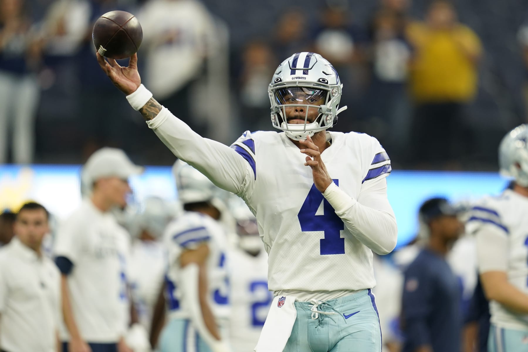 Dallas Cowboys quarterback Dak Prescott throws during warm ups before a preseason NFL football game against the Los Angeles Chargers Saturday, Aug. 20, 2022, in Inglewood, Calif. (AP Photo/Ashley Landis)