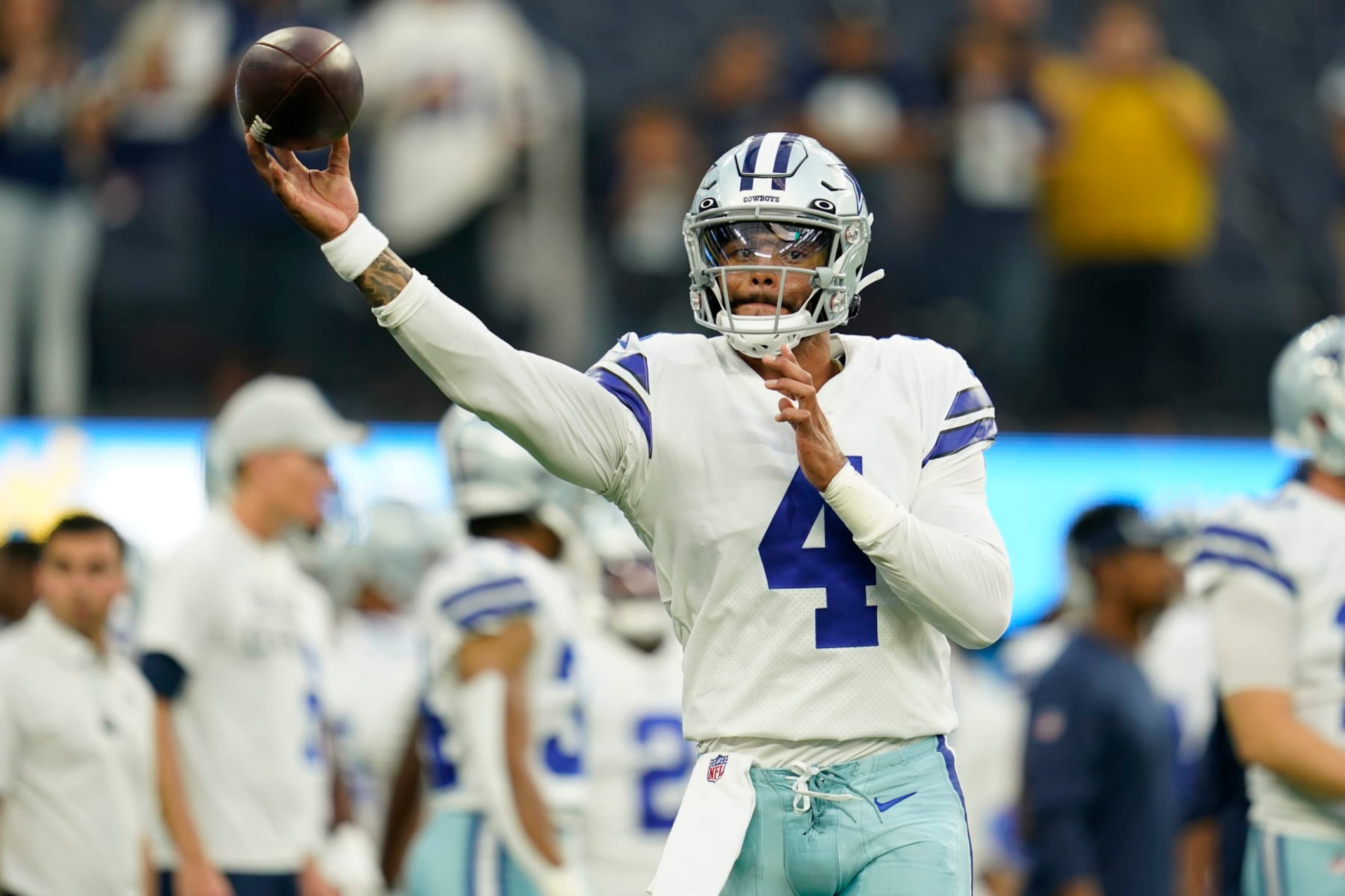 Dallas Cowboys quarterback Dak Prescott throws during warm ups before a preseason NFL football game against the Los Angeles Chargers Saturday, Aug. 20, 2022, in Inglewood, Calif. (AP Photo/Ashley Landis)