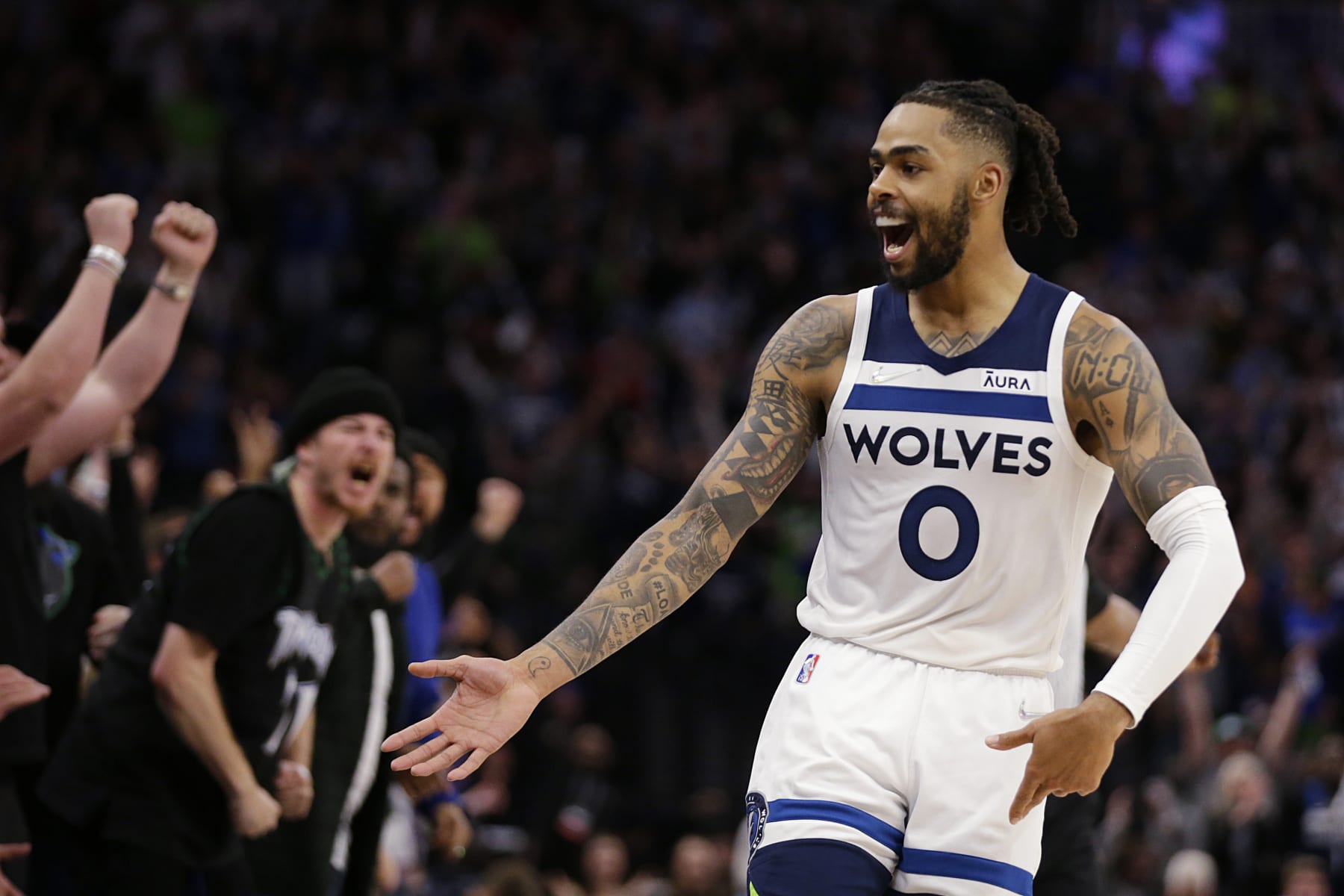 Minnesota Timberwolves guard D'Angelo Russell celebrates after a 3-point basket during the fourth quarter of the team's NBA basketball game against the Los Angeles Clippers on Tuesday, April 12, 2022, in Minneapolis. (AP Photo/Andy Clayton-King)