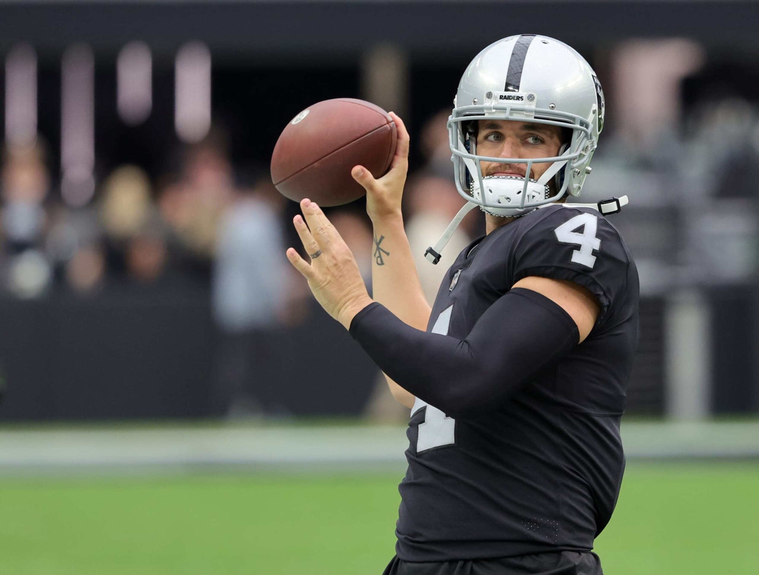 LAS VEGAS, NEVADA - AUGUST 14: Quarterback Derek Carr #4 of the Las Vegas Raiders throws during warmups before a preseason game against the Minnesota Vikings at Allegiant Stadium on August 14, 2022 in Las Vegas, Nevada. The Raiders defeated Vikings the 26-20. (Photo by Ethan Miller/Getty Images)