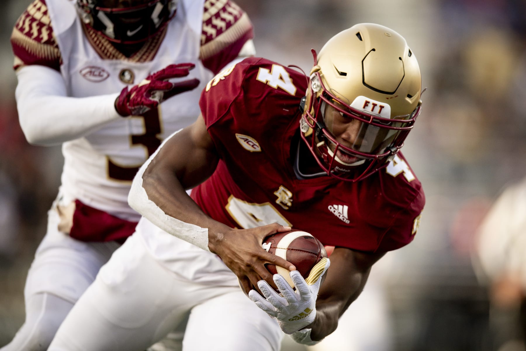 CHESTNUT HILL, MASSACHUSETTS - NOVEMBER 20: Zay Flowers #4 of the Boston College Eagles catches a touchdown pass during the third quarter against the Florida State Seminoles at Alumni Stadium on November 20, 2021 in Chestnut Hill, Massachusetts. (Photo by Maddie Malhotra/Getty Images)