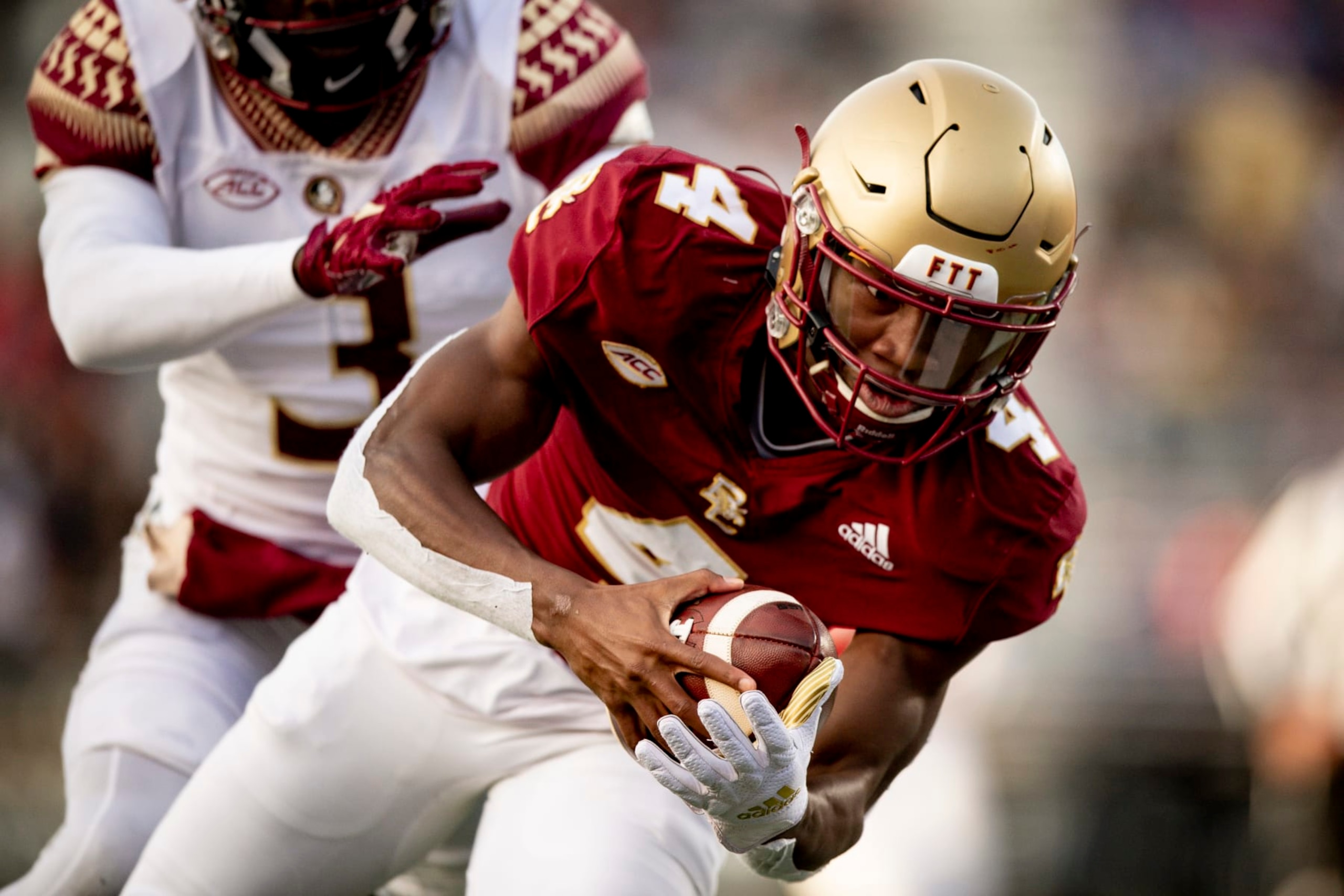 CHESTNUT HILL, MASSACHUSETTS - NOVEMBER 20: Zay Flowers #4 of the Boston College Eagles catches a touchdown pass during the third quarter against the Florida State Seminoles at Alumni Stadium on November 20, 2021 in Chestnut Hill, Massachusetts. (Photo by Maddie Malhotra/Getty Images)