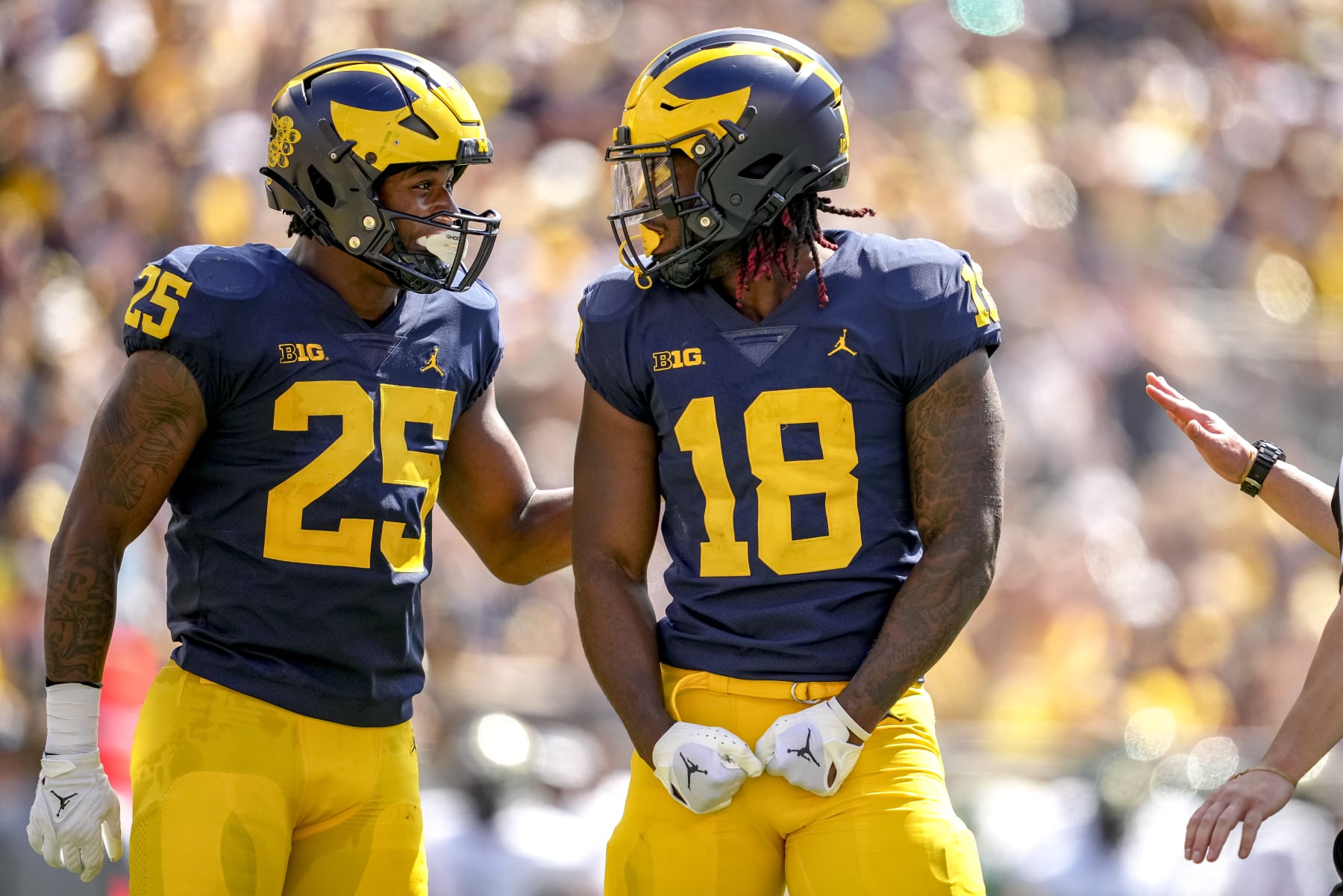 ANN ARBOR, MICHIGAN - SEPTEMBER 03: Junior Colson #25 of the Michigan Wolverines and Eyabi Anoma #18 of the Michigan Wolverines celebrate against the Colorado State Rams during the first half at Michigan Stadium on September 03, 2022 in Ann Arbor, Michigan. (Photo by Nic Antaya/Getty Images)