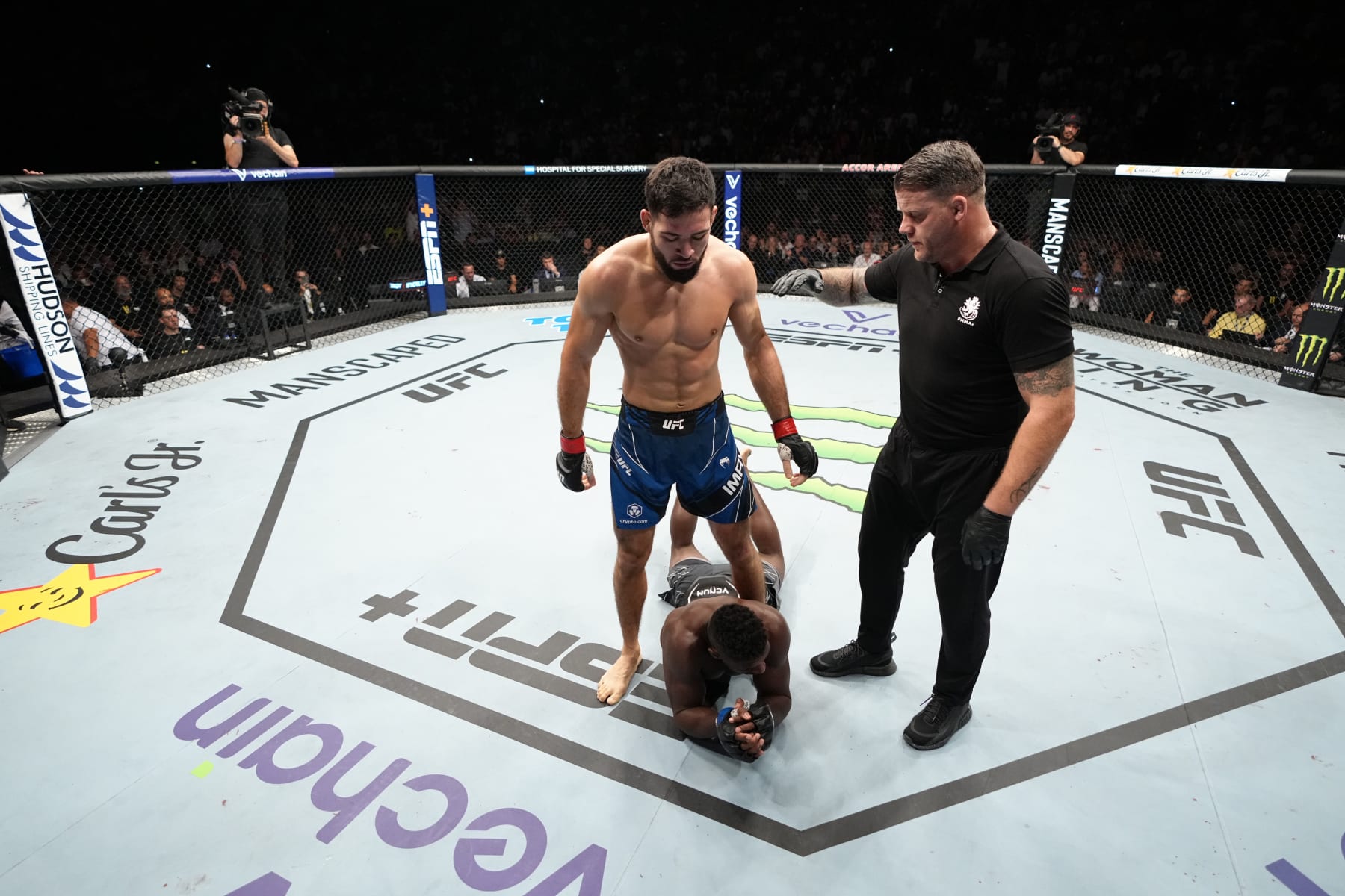 PARIS, FRANCE - SEPTEMBER 03: Nassourdine Imavov of Russia stands over Joaquin Buckley after the first round of their middleweight fight during the UFC Fight Night event at The Accor Arena on September 03, 2022 in Paris, France. (Photo by Jeff Bottari/Zuffa LLC)