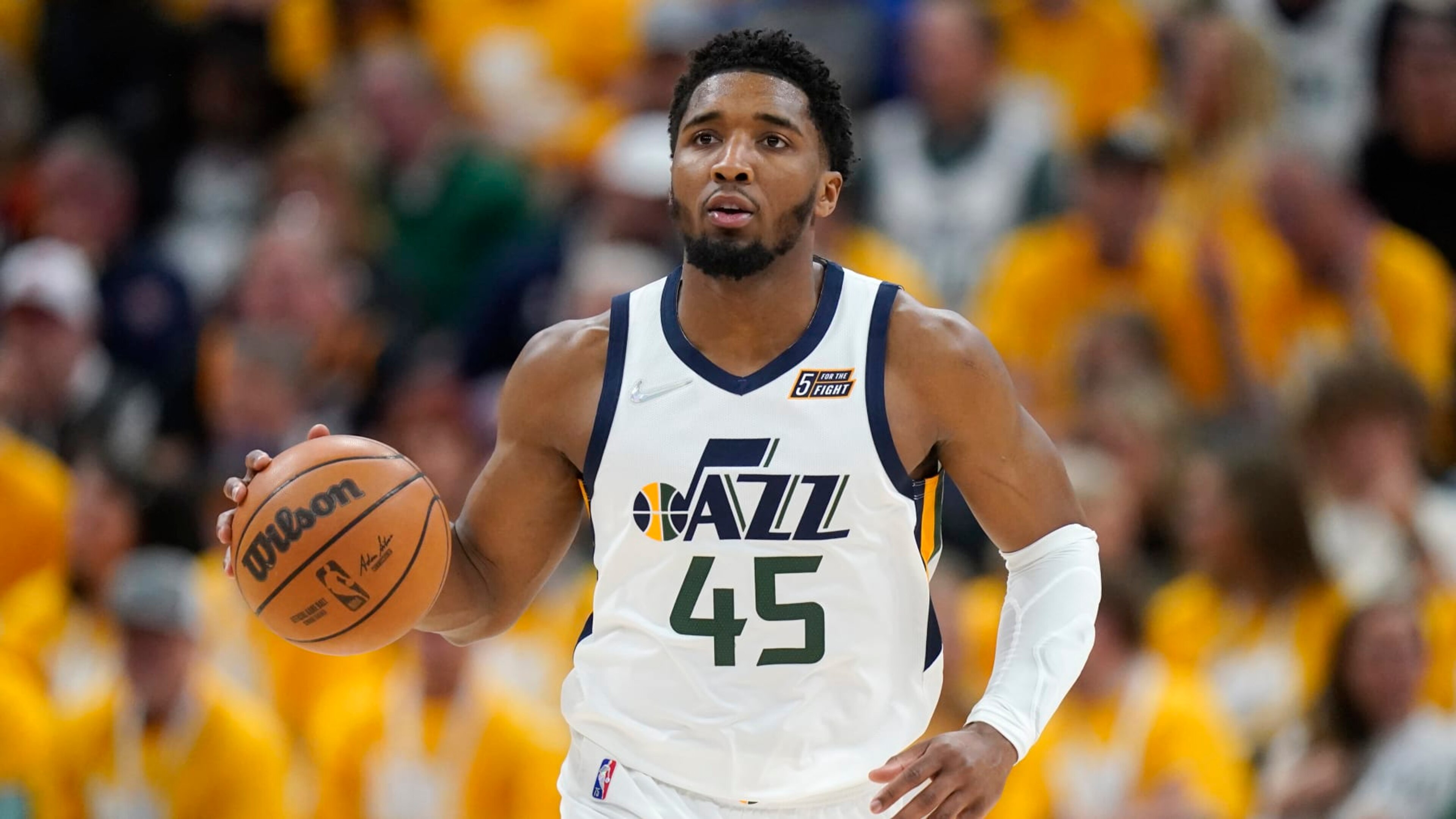 Utah Jazz guard Donovan Mitchell (45) brings the ball upcourt in the second half of Game 4 of an NBA basketball first-round playoff series against the Dallas Mavericks, Saturday, April 23, 2022, in Salt Lake City. (AP Photo/Rick Bowmer)