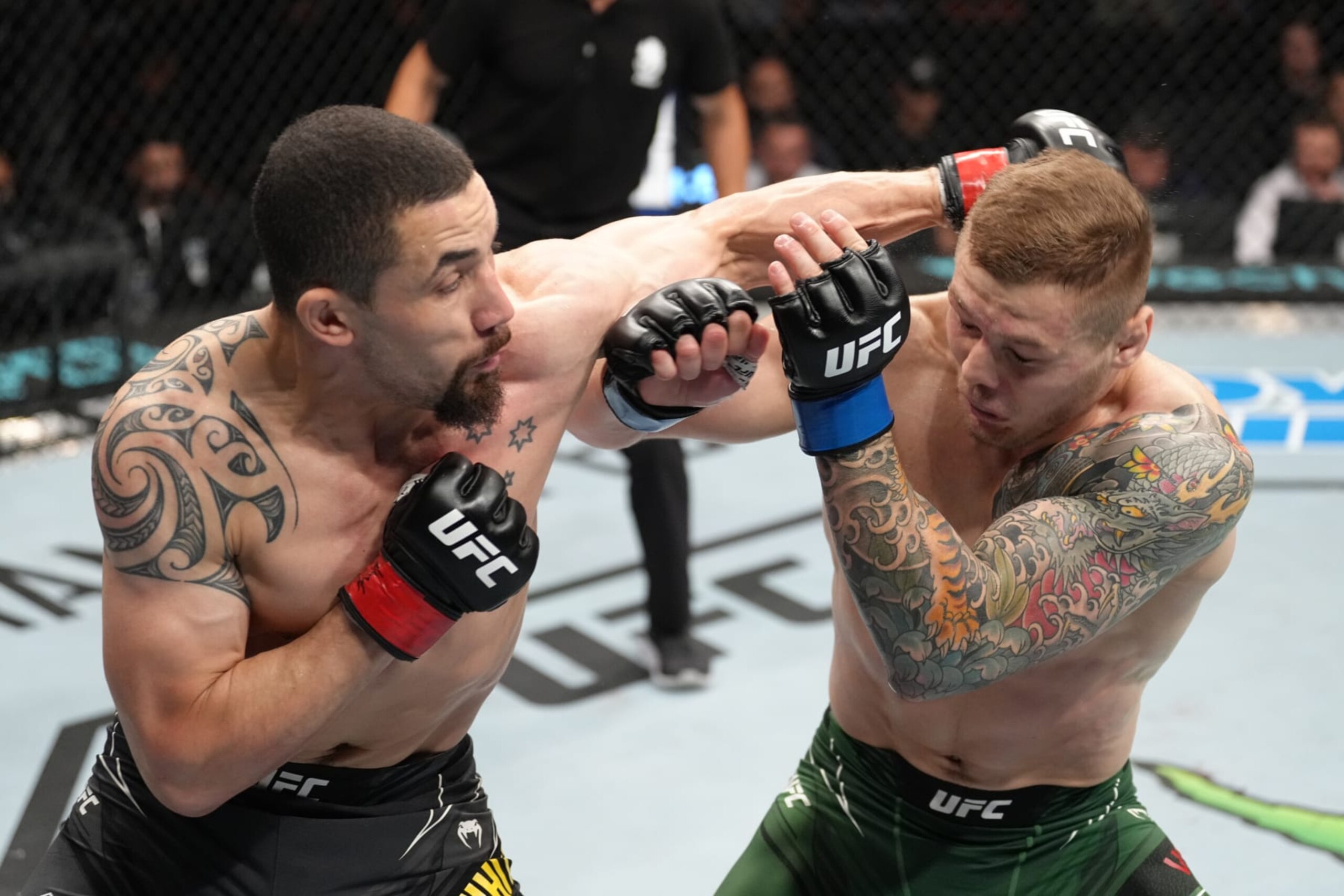PARIS, FRANCE - SEPTEMBER 03: (L-R) Robert Whittaker of New Zealand punches Marvin Vettori of Italy in a middleweight fight during the UFC Fight Night event at The Accor Arena on September 03, 2022 in Paris, France. (Photo by Jeff Bottari/Zuffa LLC)