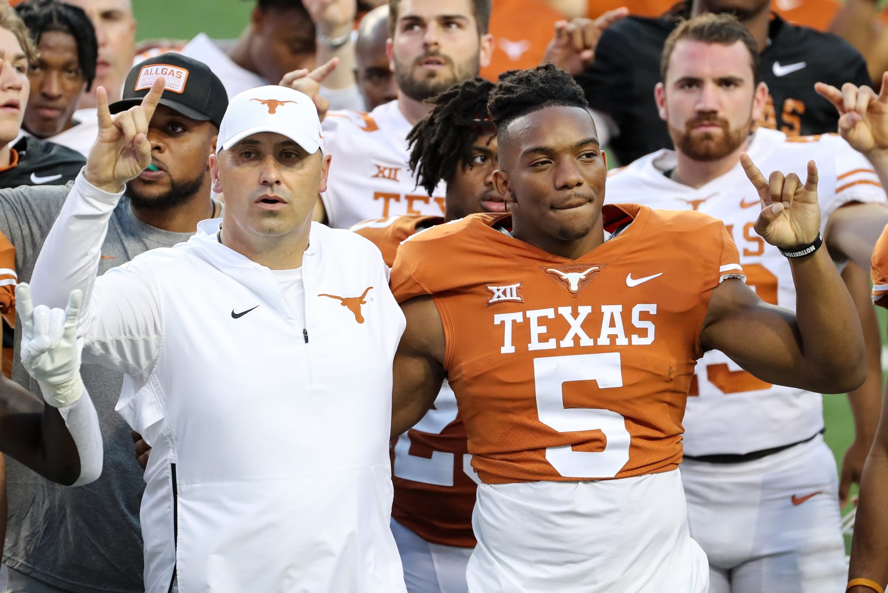 AUSTIN, TEXAS - APRIL 23: Head coach Steve Sarkisian of Texas Longhorns stands Bijan Robinson #5 during the Eyes of Texas after the Orange-White Spring Game at Darrell K Royal-Texas Memorial Stadium on April 23, 2022 in Austin, Texas. (Photo by Tim Warner/Getty Images)