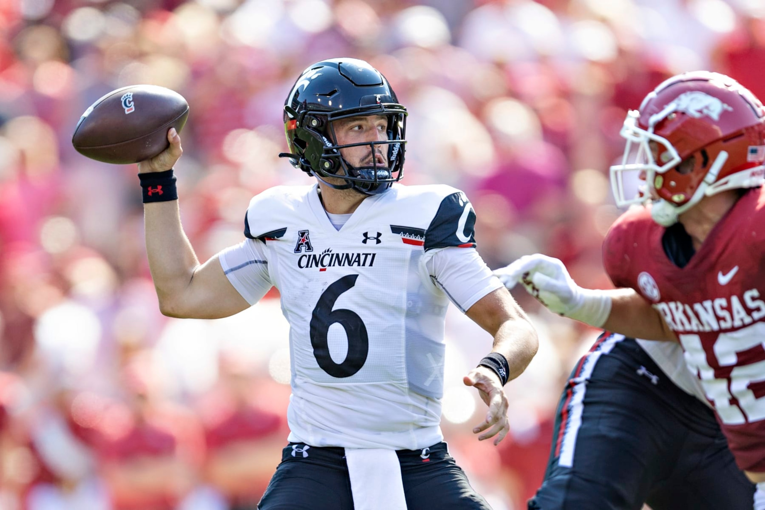 FAYETTEVILLE, ARKANSAS - SEPTEMBER 03: Ben Bryant #6 of the Cincinnati Bearcats throws a pass in the third quarter of a game against the Arkansas Razorbacks at Donald W. Reynolds Razorback Stadium on September 03, 2022 in Fayetteville, Arkansas. The Razorbacks defeated the Bearcats 31-24. (Photo by Wesley Hitt/Getty Images)