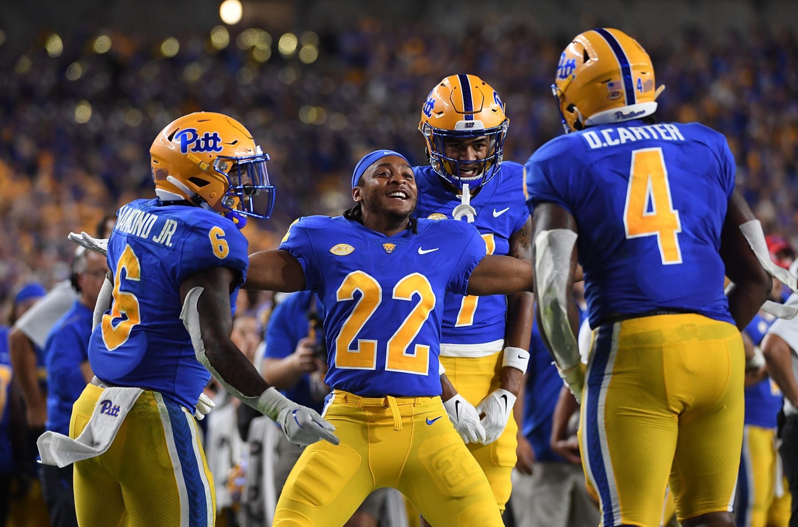 PITTSBURGH, PA - SEPTEMBER 01: Vincent Davis #22 of the Pittsburgh Panthers celebrates after a touchdown run by Daniel Carter #4 in the third quarter during the game against the West Virginia Mountaineers at Acrisure Stadium on September 1, 2022 in Pittsburgh, Pennsylvania. (Photo by Justin Berl/Getty Images)