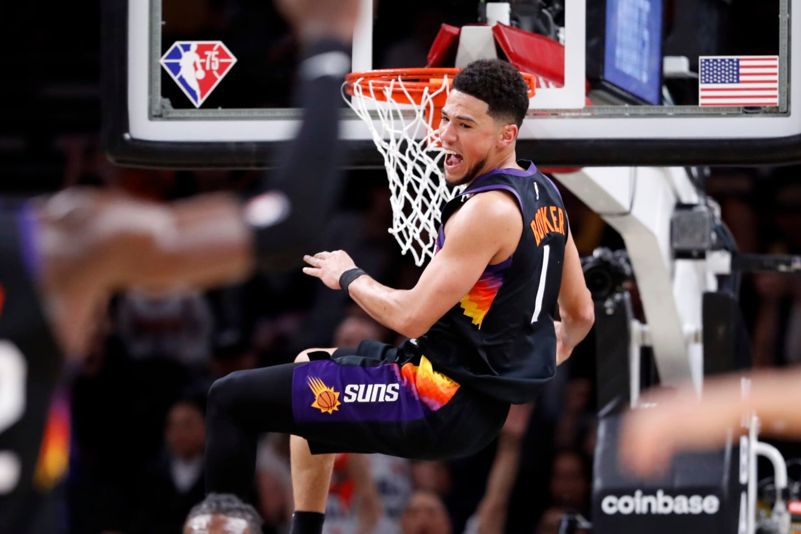 PHOENIX, ARIZONA - MARCH 13: Devin Booker #1 of the Phoenix Suns reacts after dunking the ball during the first half against the Los Angeles Lakers at Footprint Center on March 13, 2022 in Phoenix, Arizona. NOTE TO USER: User expressly acknowledges and agrees that, by downloading and or using this photograph, User is consenting to the terms and conditions of the Getty Images License Agreement.  (Photo by Chris Coduto/Getty Images)