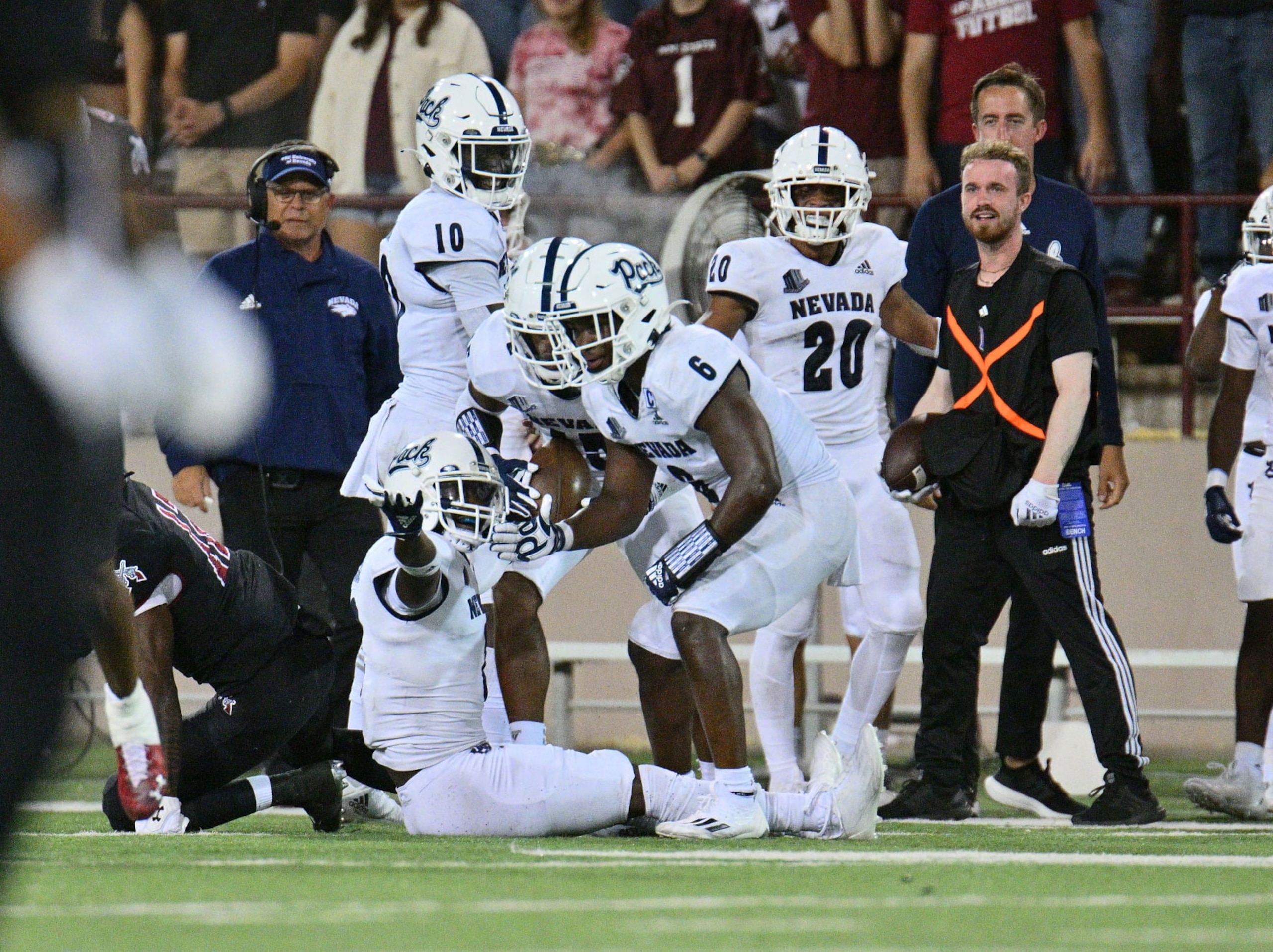 LAS CRUCES, NEW MEXICO - AUGUST 27:  Cornerback Isaiah Essissima #2 of the Nevada Wolf Pack celebrates with defensive back Tyson Williams #6 after intercepting a pass against the New Mexico State Aggies during the first half of their game at Aggie Memorial Stadium on August 27, 2022 in Las Cruces, New Mexico. (Photo by Sam Wasson/Getty Images)