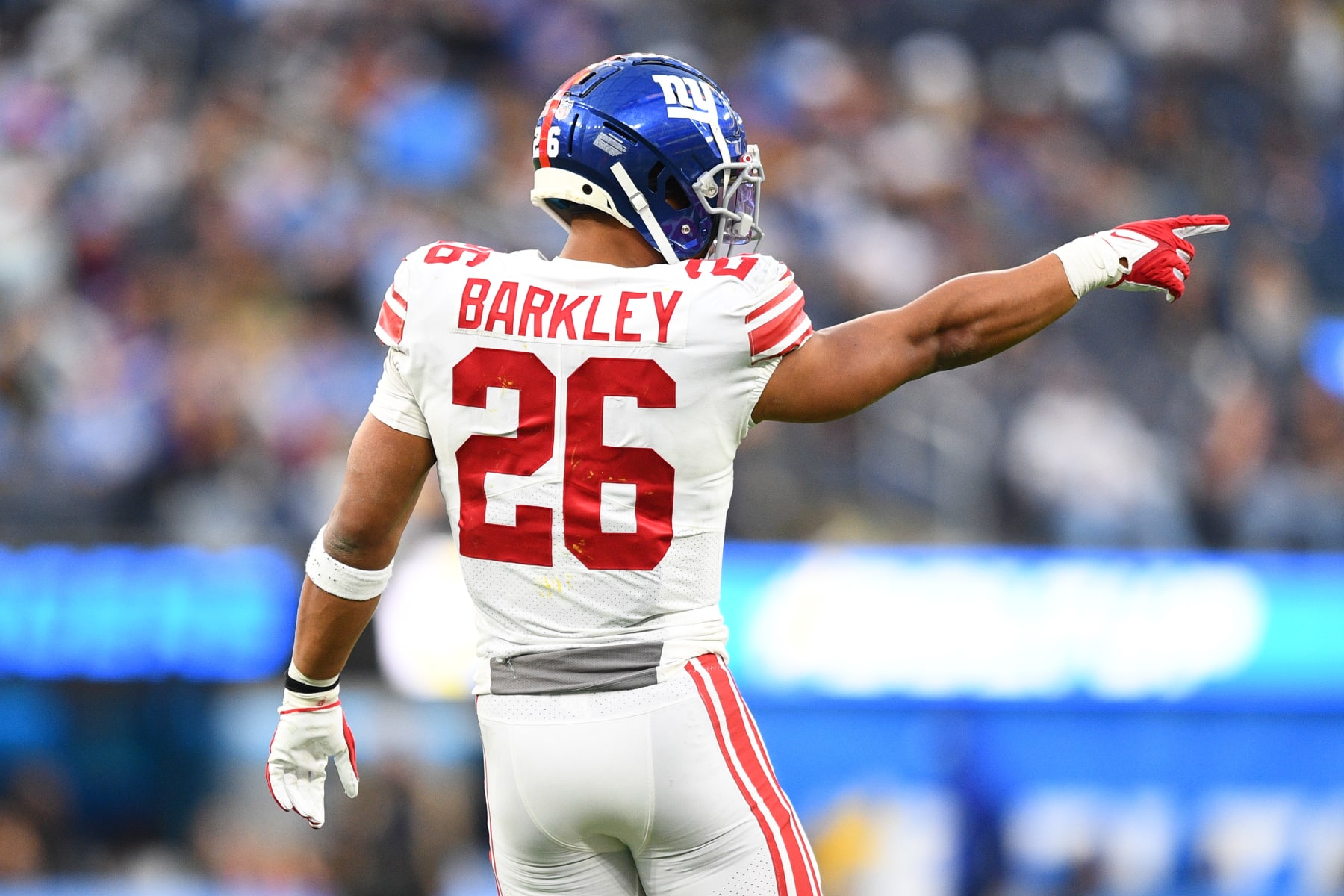 INGLEWOOD, CA - DECEMBER 12: New York Giants Running Back Saquon Barkley (26) celebrates after a touchdown during the NFL game between the New York Giants and the Los Angeles Chargers on December 12, 2021, at SoFi Stadium in Inglewood, CA. (Photo by Brian Rothmuller/Icon Sportswire via Getty Images)