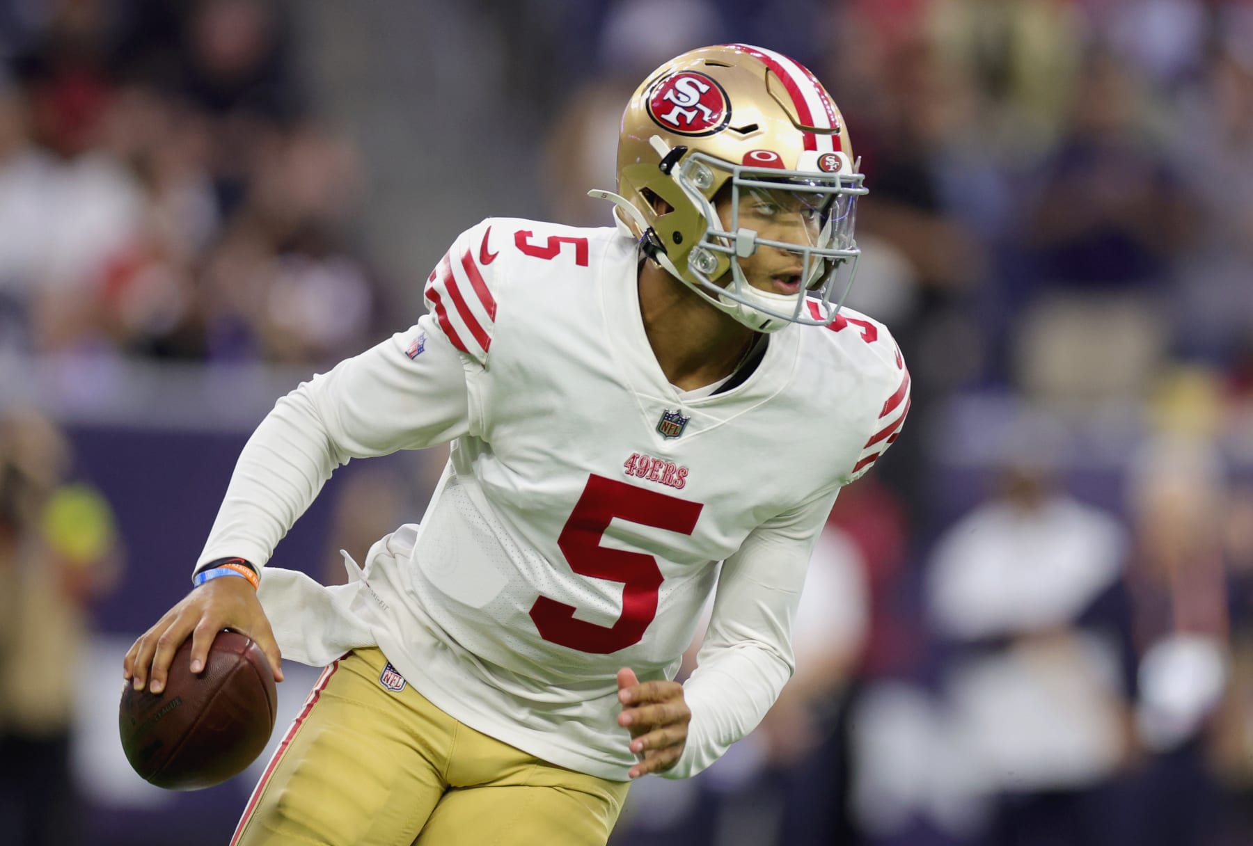HOUSTON, TEXAS - AUGUST 25: Trey Lance #5 of the San Francisco 49ers looks to pass during the first quarter of a preseason game against the Houston Texans at NRG Stadium on August 25, 2022 in Houston, Texas. (Photo by Carmen Mandato/Getty Images)