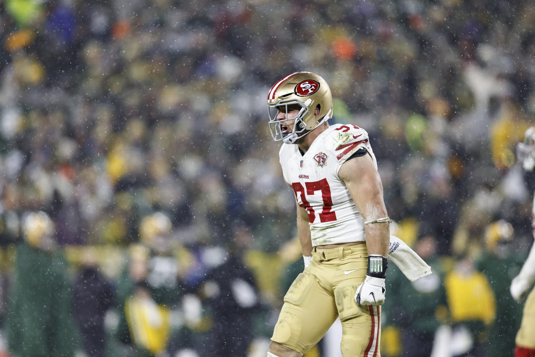 GREEN BAY, WISCONSIN - JANUARY 22: Nick Bosa #97 of the San Francisco 49ers reacts and celebrates after a sack on the Green Bay Packers during an NFL divisional playoff football game at Lambeau Field on January 22, 2022 in Green Bay, Wisconsin. The 49ers won 13-10. (Photo by Michael Owens/Getty Images)