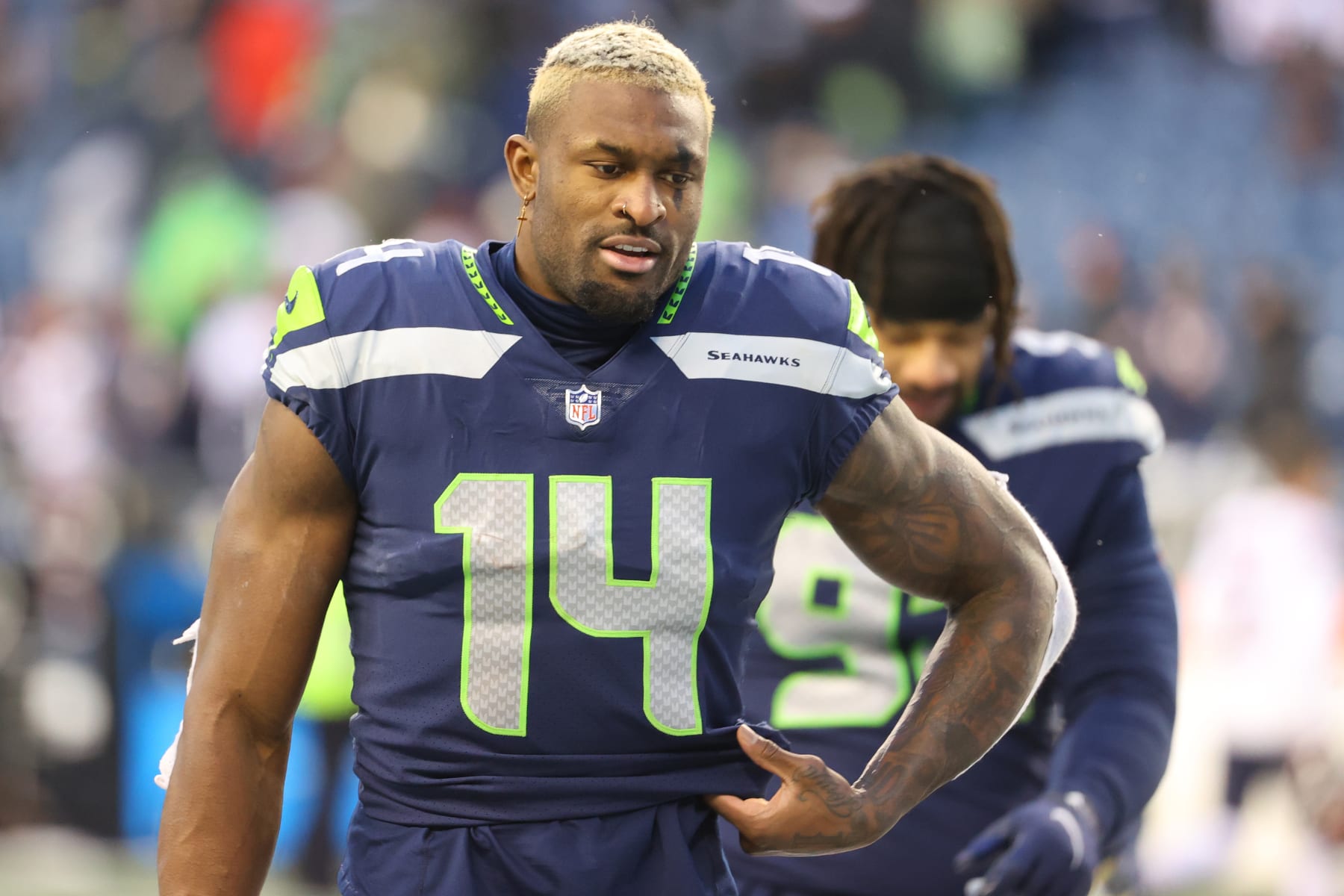 SEATTLE, WASHINGTON - DECEMBER 26: DK Metcalf #14 of the Seattle Seahawks reacts after the 25-24 loss to the Chicago Bears at Lumen Field on December 26, 2021 in Seattle, Washington. (Photo by Abbie Parr/Getty Images)