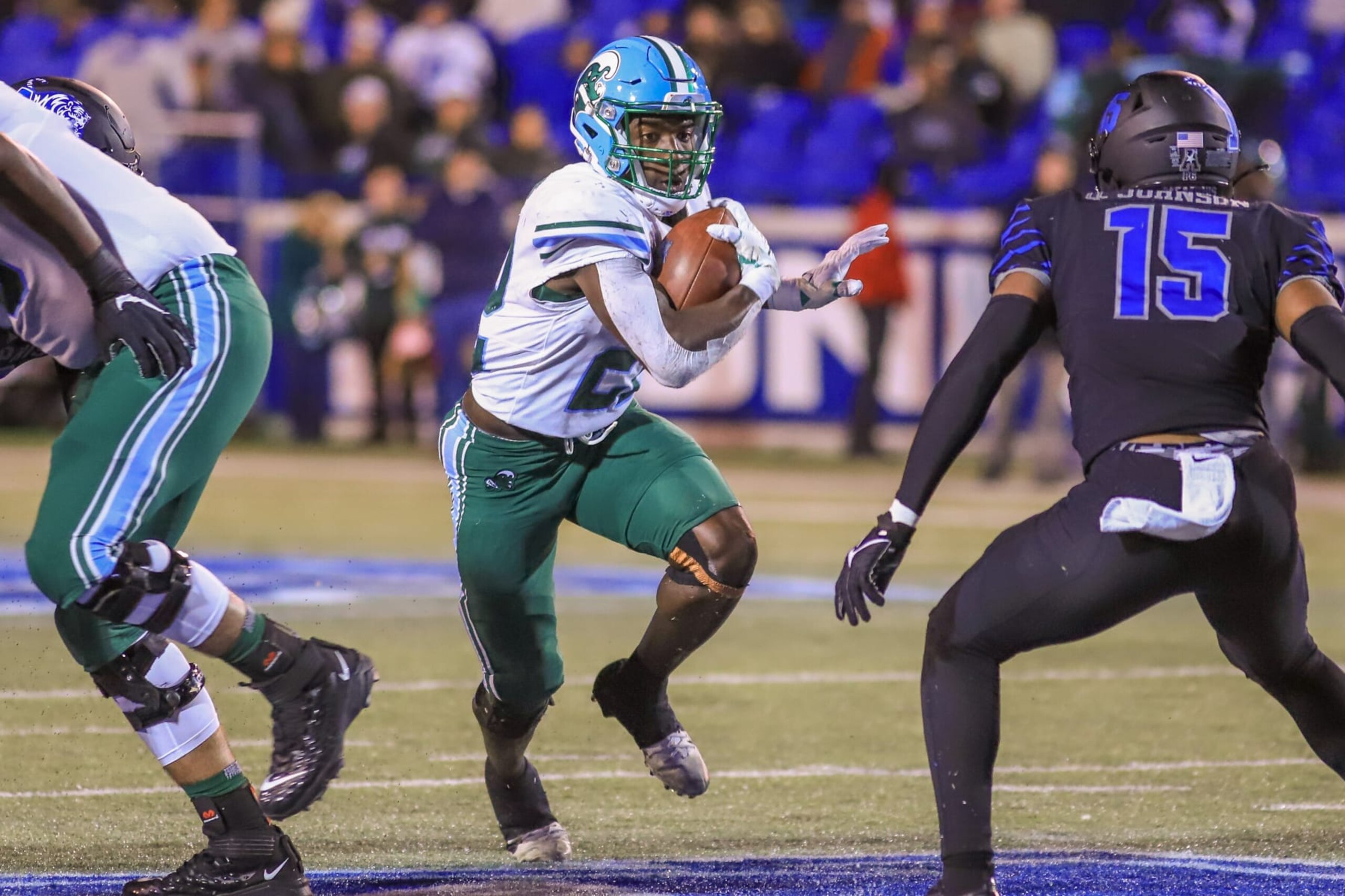 MEMPHIS, TN - NOVEMBER 27: Tulane Green Wave running back Tyjae Spears (22) looks to avoid a defender during the game between the Memphis Tigers and the Tulane Green Wave on November 27, 2021, at The Liberty Bowl Memorial Stadium in Memphis, TN (Photo by Chris McDill/Icon Sportswire via Getty Images)