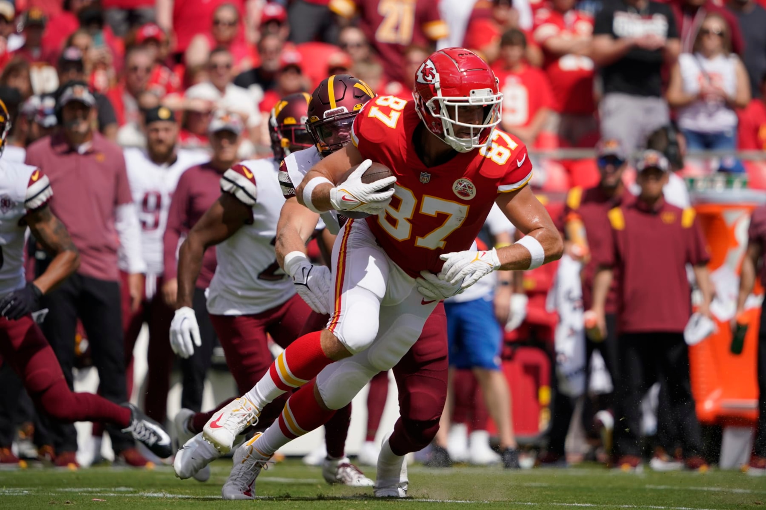 Kansas City Chiefs tight end Travis Kelce (87) gets past Washington Commanders linebacker Cole Holcomb (55) during a preseason NFL football game Saturday, Aug. 20, 2022, in Kansas City, Mo. (AP Photo/Ed Zurga) Kansas City Chiefs tight end Travis Kelce (87) gets past Washington Commanders linebacker Cole Holcomb (55) during a preseason NFL football game Saturday, Aug. 20, 2022, in Kansas City, Mo. (AP Photo/Ed Zurga)