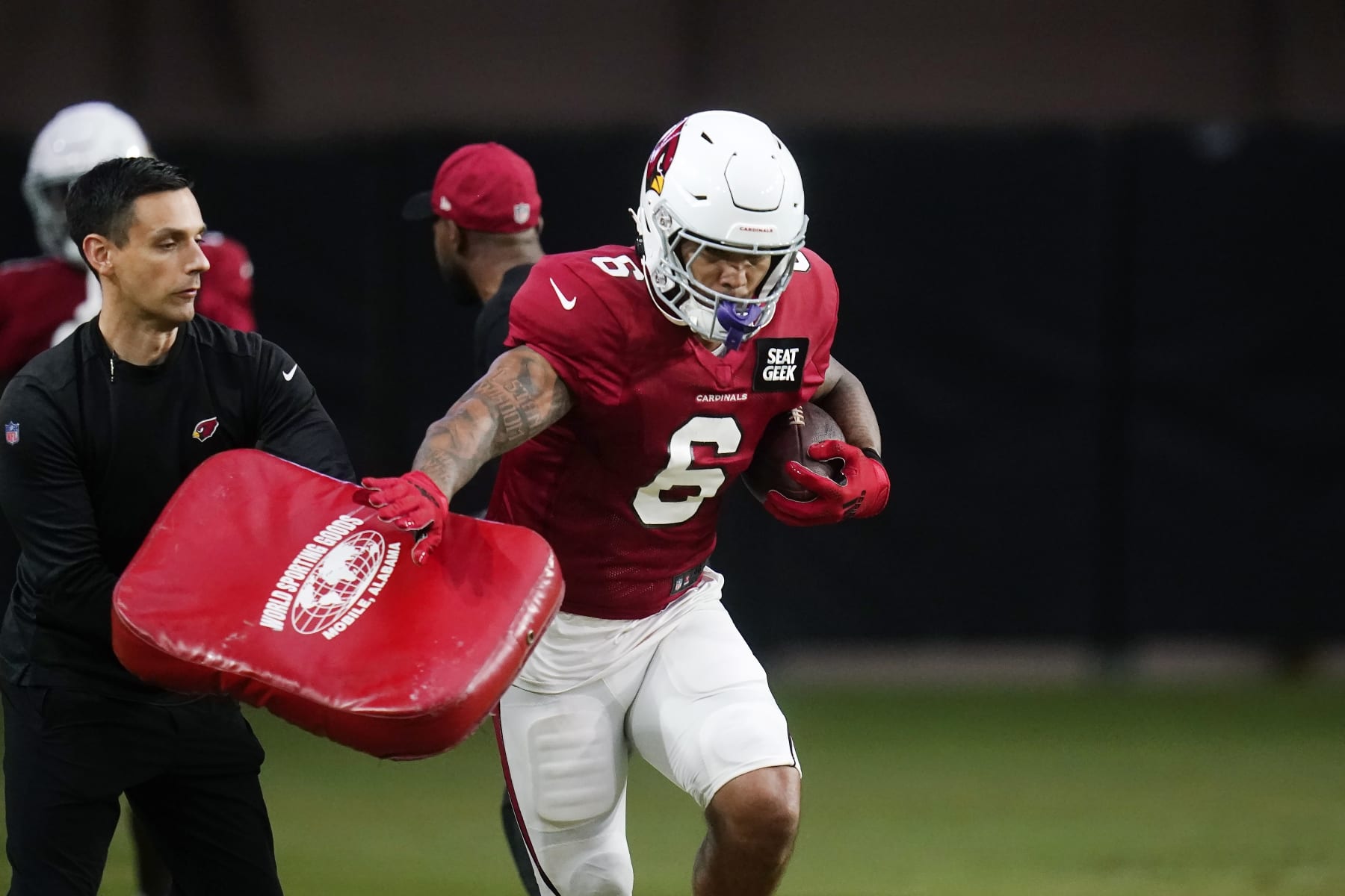 Arizona Cardinals running back James Conner runs with the football during the NFL football team's training camp Tuesday, Aug. 9, 2022, in Glendale, Ariz. (AP Photo/Ross D. Franklin)