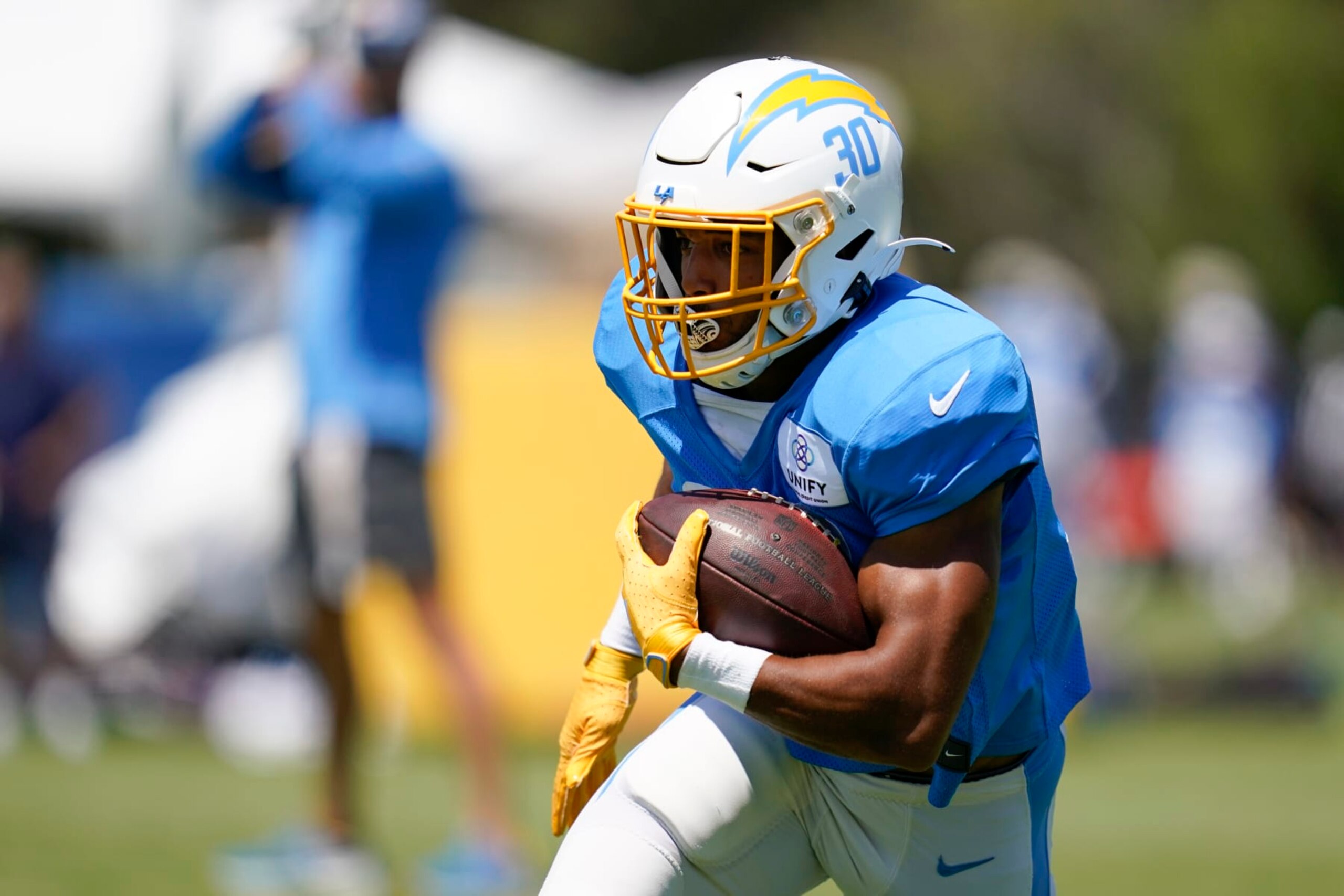 Los Angeles Chargers running back Austin Ekeler (30) participates in drills during a combined NFL practice with the Dallas Cowboys at the Los Angeles Rams' practice facility in Costa Mesa, Calif. Thursday, Aug. 18, 2022. (AP Photo/Ashley Landis)