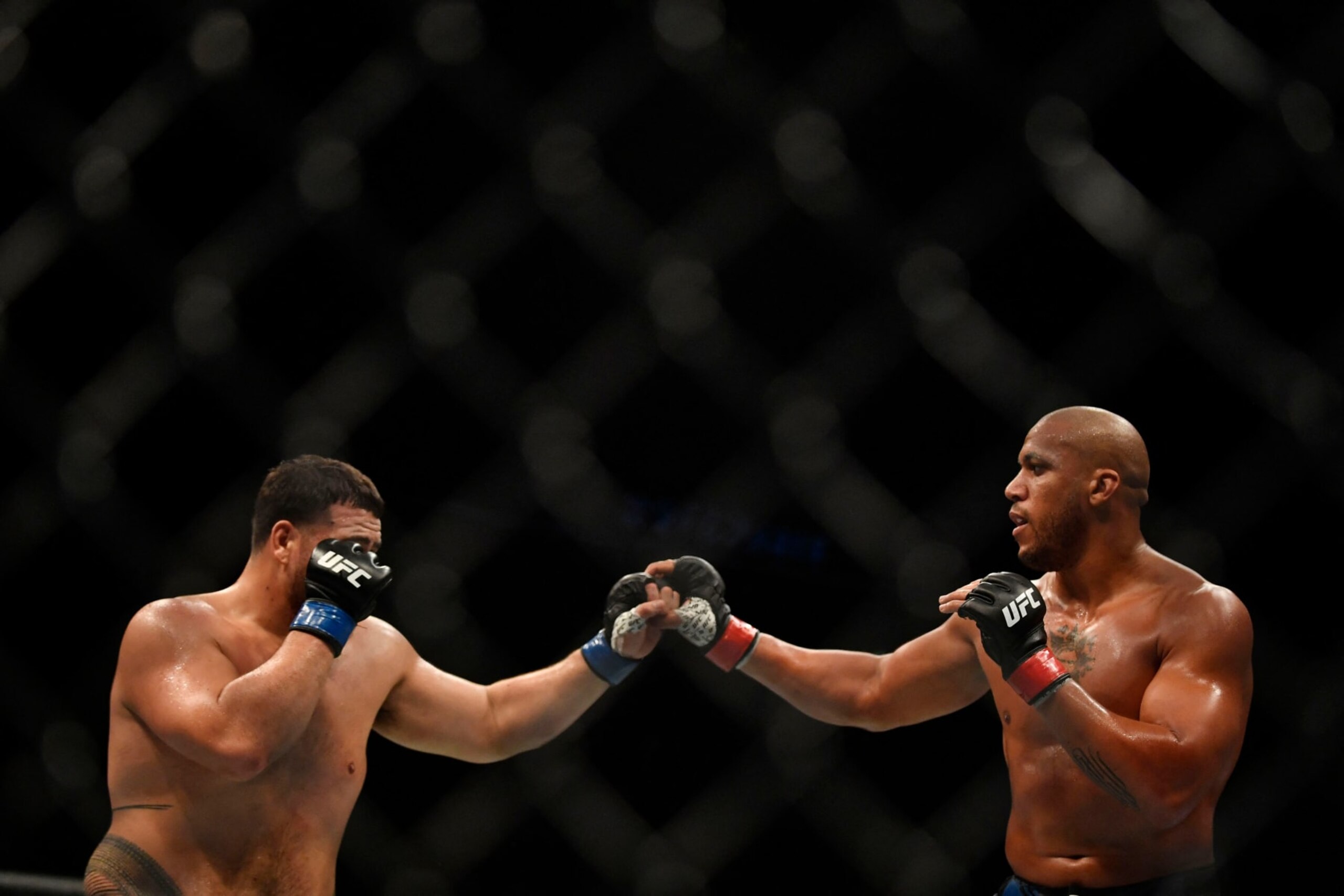 French fighter Ciryl Gane (R) competes against Australian fighter Tai Tuivasa (L) in their men's heavyweight fight during the Ultimate Fighting Championship (UFC) event at the Accor Arena in Paris, on September 3, 2022. (Photo by JULIEN DE ROSA / AFP) (Photo by JULIEN DE ROSA/AFP via Getty Images)