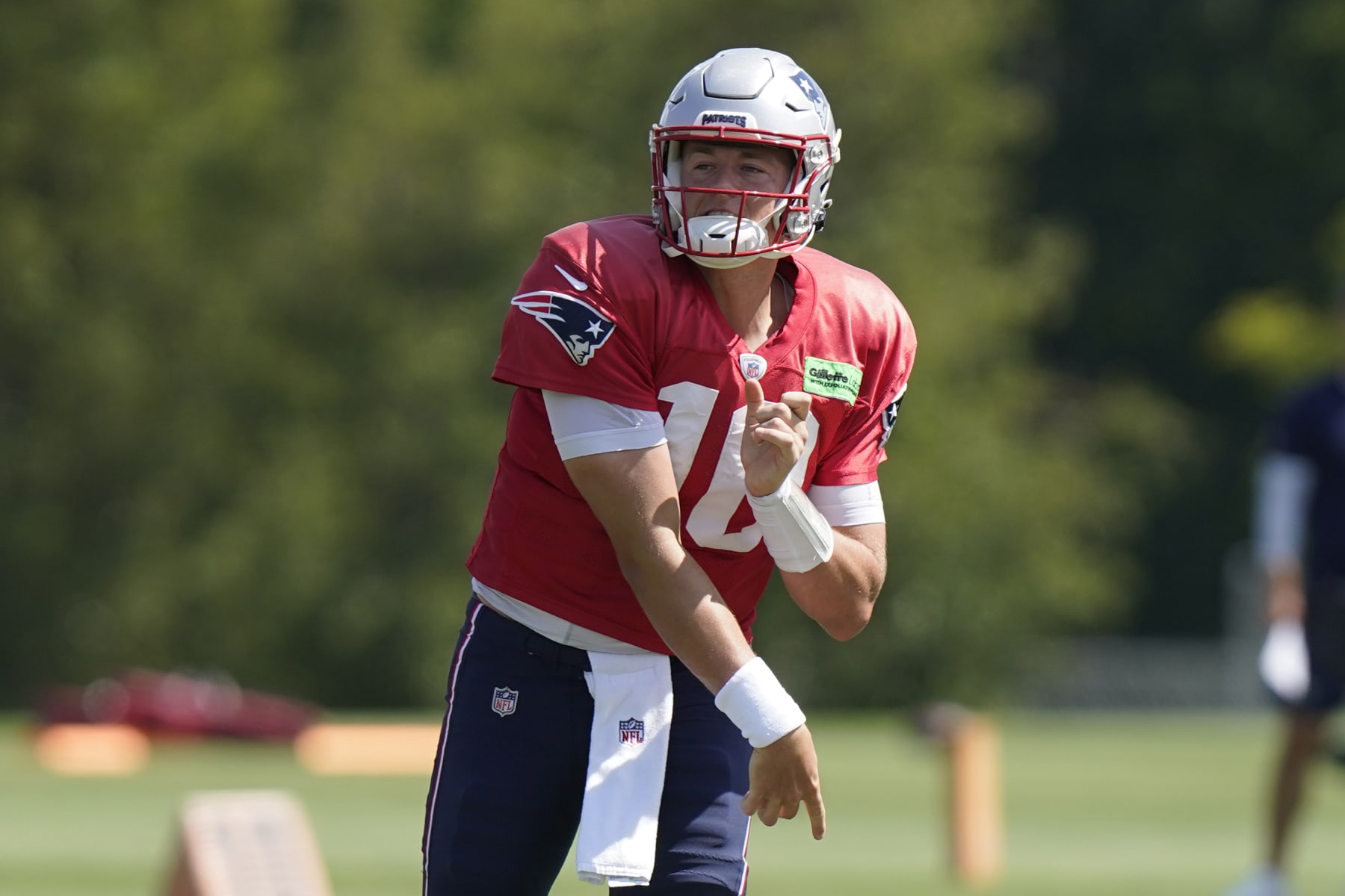 New England Patriots quarterback Mac Jones (10) follows through on a pass during an NFL football practice, Wednesday, Aug. 31, 2022, in Foxborough, Mass. (AP Photo/Steven Senne)
