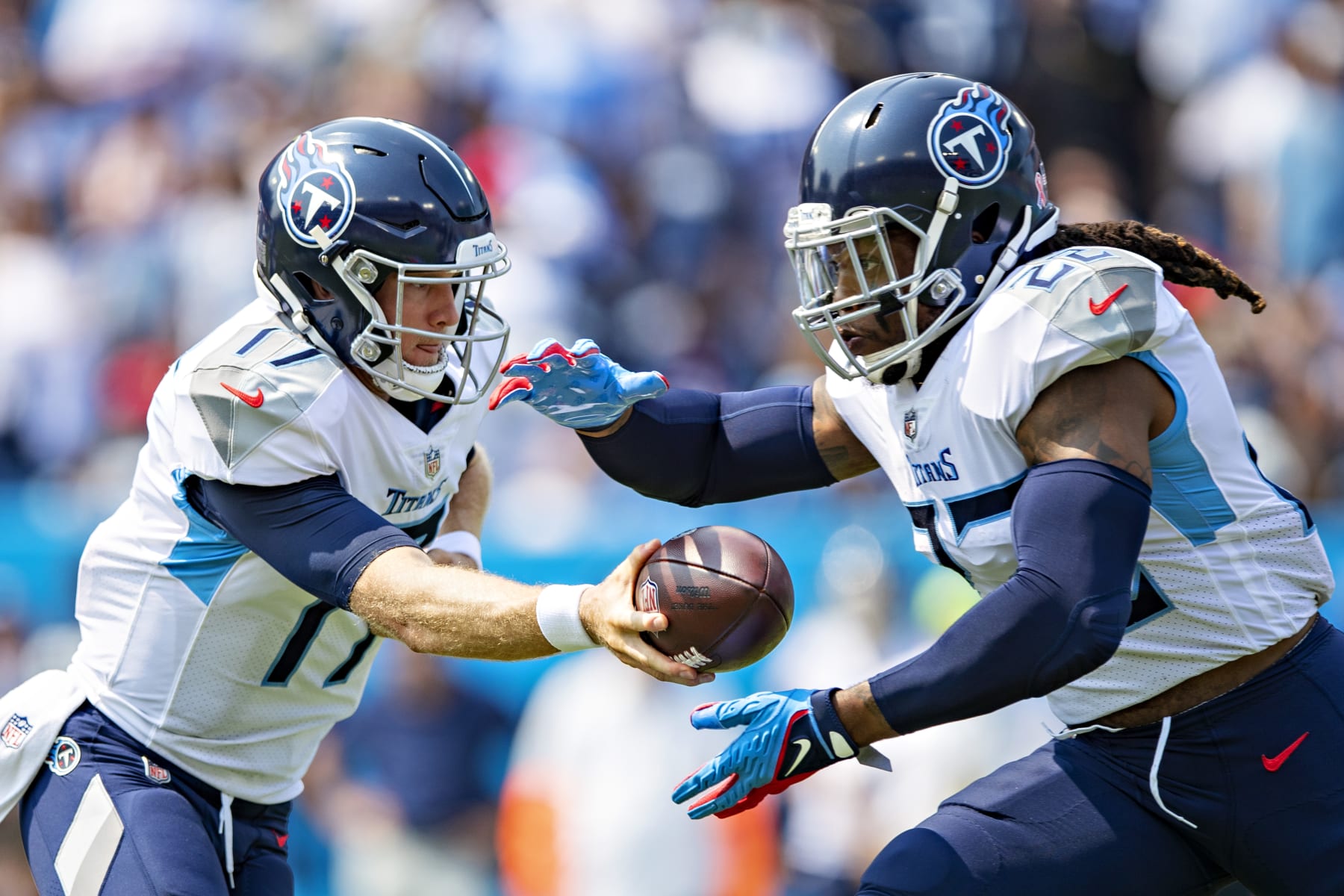 NASHVILLE, TENNESSEE - SEPTEMBER 12: Ryan Tannehill #17 makes a hand off to Derrick Henry #22 of the Tennessee Titans during the game against the Arizona Cardinals at Nissan Stadium on September 12, 2021 in Nashville, Tennessee. The Cardinals defeated the Titans 38-13.  (Photo by Wesley Hitt/Getty Images)