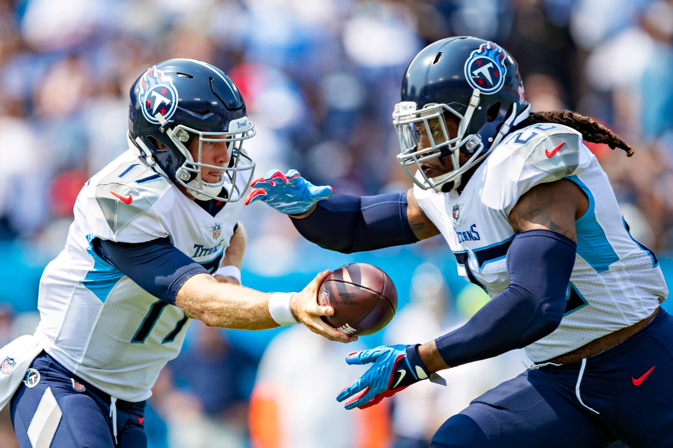 NASHVILLE, TENNESSEE - SEPTEMBER 12: Ryan Tannehill #17 makes a hand off to Derrick Henry #22 of the Tennessee Titans during the game against the Arizona Cardinals at Nissan Stadium on September 12, 2021 in Nashville, Tennessee. The Cardinals defeated the Titans 38-13.  (Photo by Wesley Hitt/Getty Images)