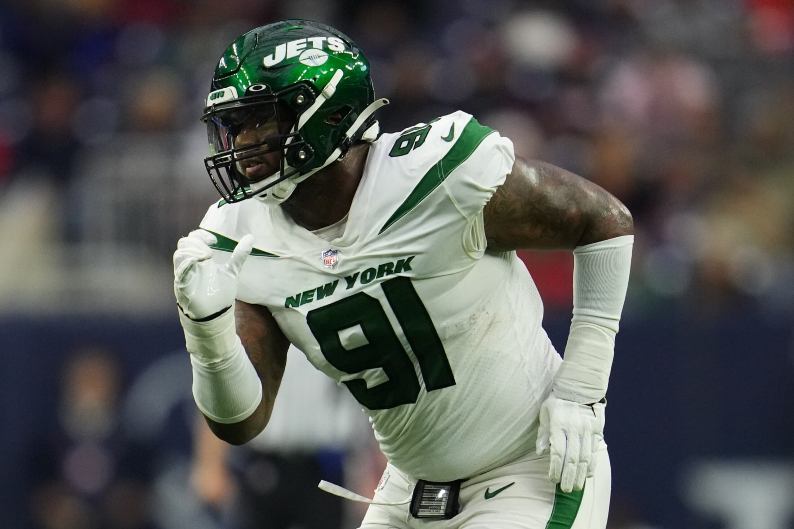 HOUSTON, TEXAS - NOVEMBER 28: John Franklin-Myers #91 of the New York Jets defends against the Houston Texans during an NFL game at NRG Stadium on November 28, 2021 in Houston, Texas. (Photo by Cooper Neill/Getty Images)
