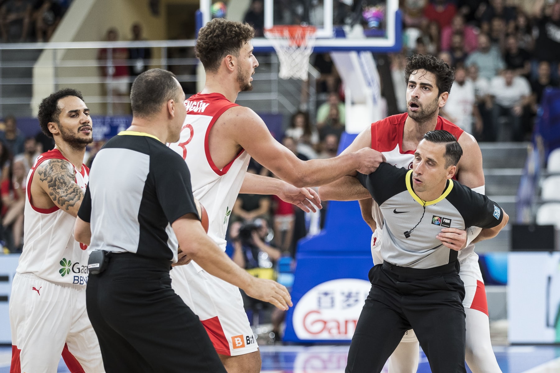 TBILISI, GEORGIA - SEPTEMBER 04: The referee protect Furkan Korkmaz of Turkey from the other players during the FIBA EuroBasket 2022 group A match between Turkey and Georgia at Tbilisi Arena on September 4, 2022 in Tbilisi, Georgia. (Photo by Nikola Krstic/MB Media/Getty Images)